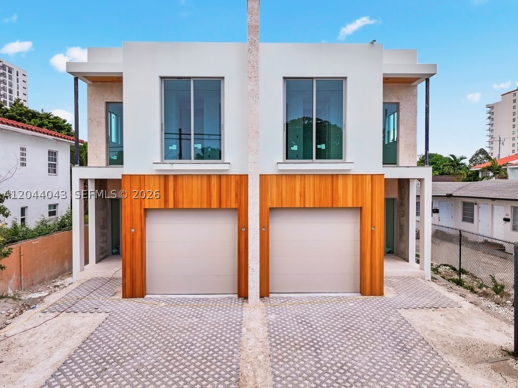 Modern luxury meets timeless Miami elegance in the heart of Silver Bluff. These brand-new 4-bedroom, 4-bathroom townhomes offer nearly 3,000 sq. ft. of thoughtfully designed living space just minutes from Coconut Grove, Coral Gables, and Brickell.    Natural wood accents flow from the striking exterior into the grand entrance, creating a warm and sophisticated first impression. Inside, each residence features impact glass windows and doors, designer lighting, imported finishes, and built-in ceiling speakers for seamless indoor and outdoor entertaining.    The chef’s kitchen is beautifully appointed with Italian cabinetry, quartz countertops, and premium stainless-steel appliances. Open-concept living spaces flow effortlessly to a private terrace and stunning coral accents —perfect for entertaining under the Miami sky.    Additional highlights include smart-home technology, dry bar on the second floor, a one-car garage and pool    Located within walking distance to Coral Way cafés, top-rated schools, and the vibrant lifestyle of Coconut Grove, this is a rare opportunity to own luxury new construction in one of Miami’s most desirable neighborhoods.
