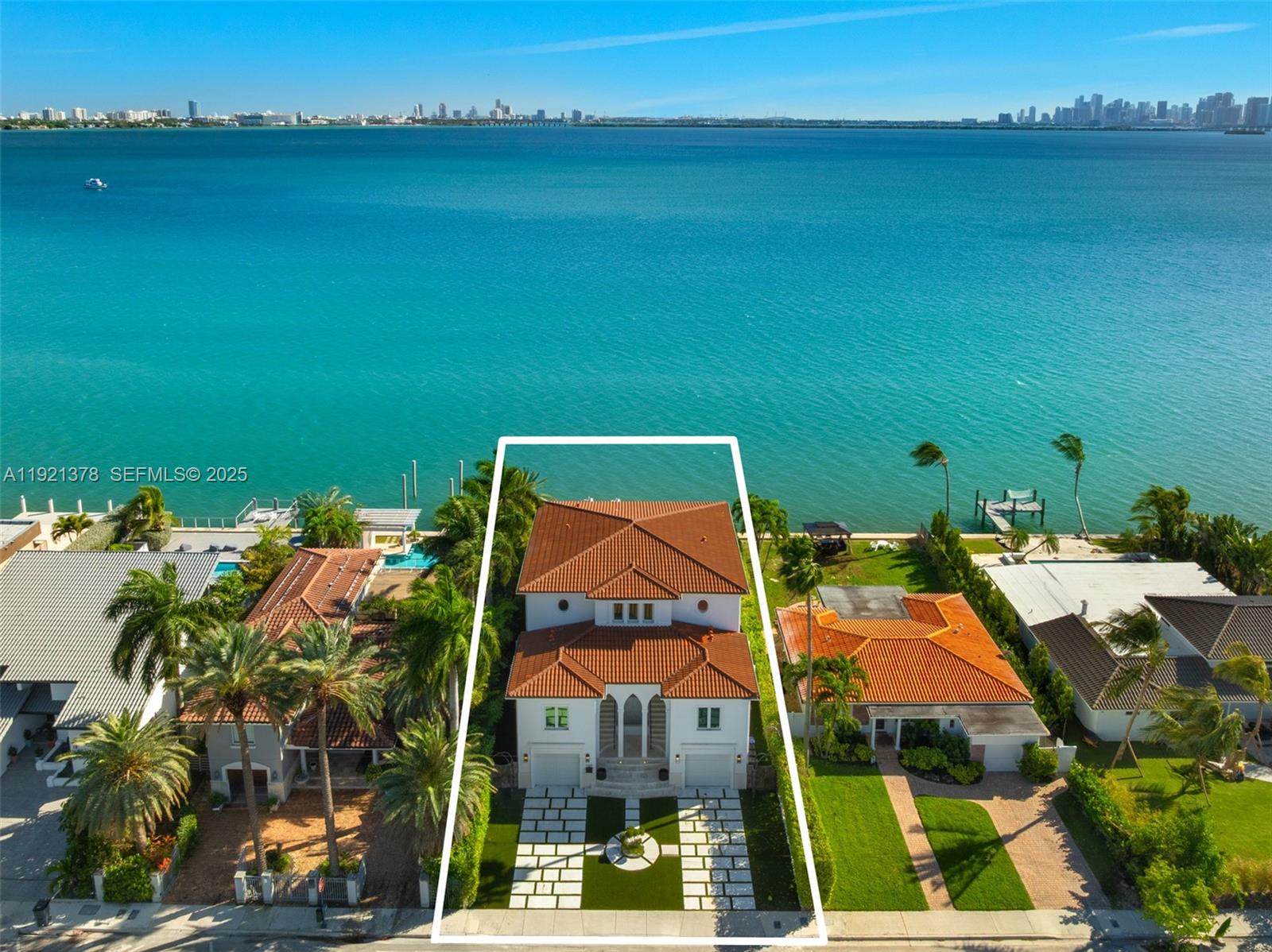 Experience wide, unobstructed, and extraordinary expansive open bay panoramic views of both the Miami and Miami Beach skylines from this exceptional island home. A grand double-door entry leads to a soaring 25’ foyer, immediately unveiling breathtaking water vistas. Designed for seamless indoor-outdoor living, floor-to-ceiling impact folding doors frame the panoramic scenery. The chef’s kitchen features a gas Wolf double-oven, indoor grill, and dual dishwashers. With 6 en-suite bedrooms, an office, gym, 9-seat theater, & game room, luxury abounds. Enjoy three oversized terraces, all day south facing sunlight, a summer kitchen, heated pool/spa, 40’ dock, 1 boat or 3-jet ski lift, 2-jet ski pads, garages for four+ cars, a whole-house generator, integrated saltwater fish tank, & an elevator.