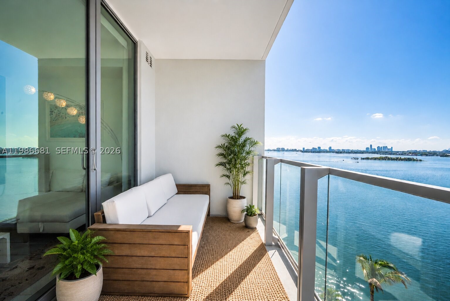 Private elevator entry to this beautifully designed 1BD/2BA in Edgewater with sweeping bay and city views through floor-to-ceiling windows and sleek porcelain tile floors. Open-concept layout with a modern kitchen, ideal for everyday living and entertaining, with seamless flow to a private balcony.
Spacious primary suite with walk-in closet and spa-style bath featuring dual vanities, soaking tub, and glass shower. In-unit laundry (new washer/dryer 2025), assigned parking, and offered fully furnished. Full-service building with resort-style amenities, now enhanced with pickleball and on-site wellness experiences like BODYBAR Pilates, steps from Whole Foods, Midtown, and top dining.