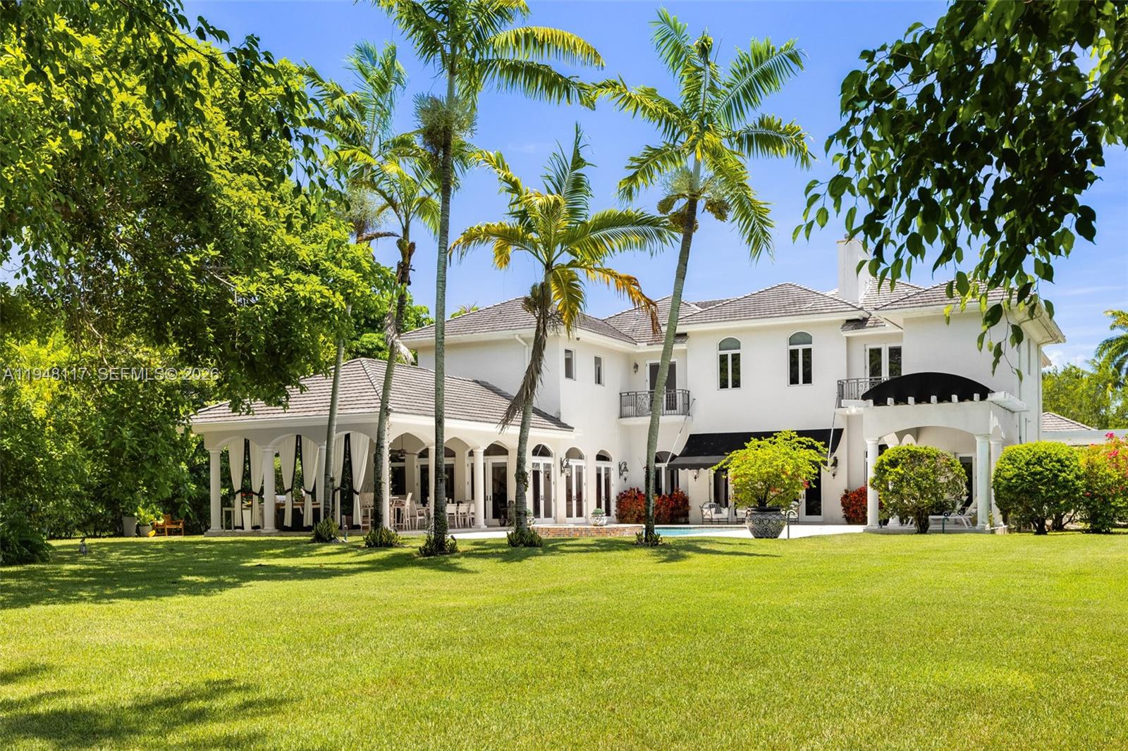 Nestled in the exclusive Ponce-Davis neighborhood, this timeless French-inspired estate offers a blend of classic
elegance and refined comfort. Set on over 51,000 square feet of lush, gated grounds, the home was crafted by
Palmira Homes and features expansive living spaces designed for gracious living and effortless entertaining. A
stately foyer opens to a formal salon, library, media room, and a gourmet kitchen with full catering pantry.
Outdoors, a summer kitchen, and a resort-style pool create a tranquil escape surrounded by manicured gardens. A
four-car garage and elevator complete this exceptional offering. Located on one of Miami’s most coveted streets,
just minutes from top schools and the best of Coral Gables. A true legacy property in one of the city's most
prestigious enclaves.