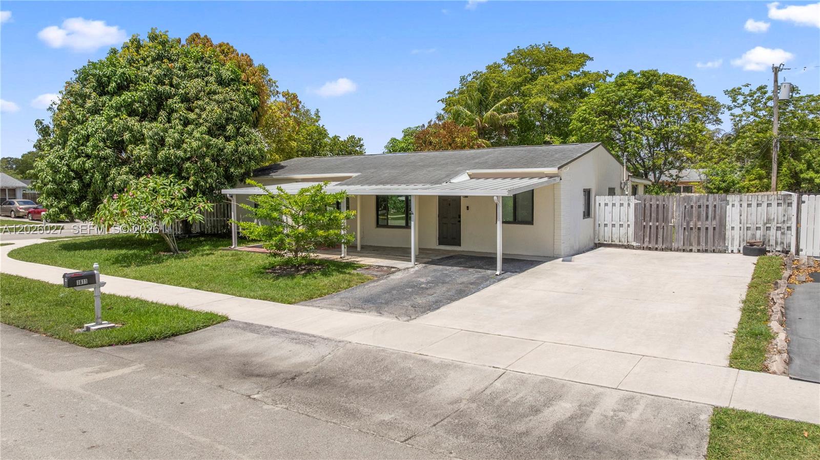 Welcome to this beautifully maintained 4-bedroom, 2-bath single-family home situated on a spacious corner lot in the heart of North Lauderdale, with no HOA. Inside, you’ll find beautiful tile flooring throughout the entire home, creating a clean and modern feel. Open kitchen with a cooking island featuring white cabinetry, durable wood countertops, SS appliances, complimentary backsplash, and a coffee/wine bar for entertaining. Featuring a 2019 roof, 2021 A/C, newer water heater, and full impact windows and doors, this home offers both peace of mind and comfort. Step outside to an oversized backyard filled with incredible fruit trees including mango, avocado, coconut, guava, papaya, jackfruit, and dragonfruit — your own private tropical retreat. Not to mention the massive screened-in patio perfect for entertaining or to enjoy the outdoors. Conveniently located near supermarkets, restaurants, schools, parks, major highways, and more, this home combines space, location, and lifestyle all in one.