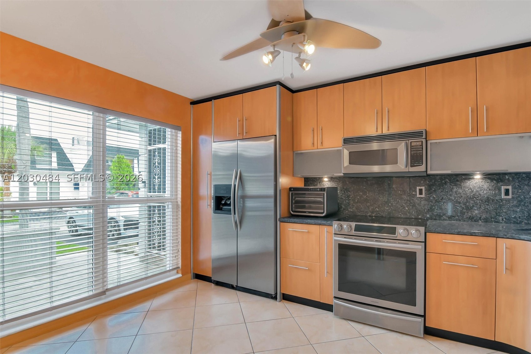 WELCOME HOME! This spacious 3-bedroom, 2.5-bath townhouse is located on the most desirable street in Venetian Park and is perfectly positioned just steps from the pool, clubhouse, and other amenities. Inside, you'll find a bright and inviting floor plan featuring an open-concept kitchen that seamlessly connects to the living and dining areas, creating the perfect space for entertaining and everyday living. Additional highlights include hurricane impact windows, tankless water heater, a fenced backyard, a second-floor balcony, very spacious master walk-in closet, beautifully renovated master bathroom, washer/dryer and two assigned parking spaces conveniently located right in front of the home. There is also plenty of guest parking for family and friends. Maintenance fees conveniently include water, cable, and internet. What sets this property apart is the sense of community. Many residents have proudly called Venetian Park home for decades, creating a welcoming neighborhood atmosphere that is hard to find. Enjoy regular game nights and social gatherings at the clubhouse, where neighbors become friends and community connections thrive. This is more than just a home—it's a lifestyle.