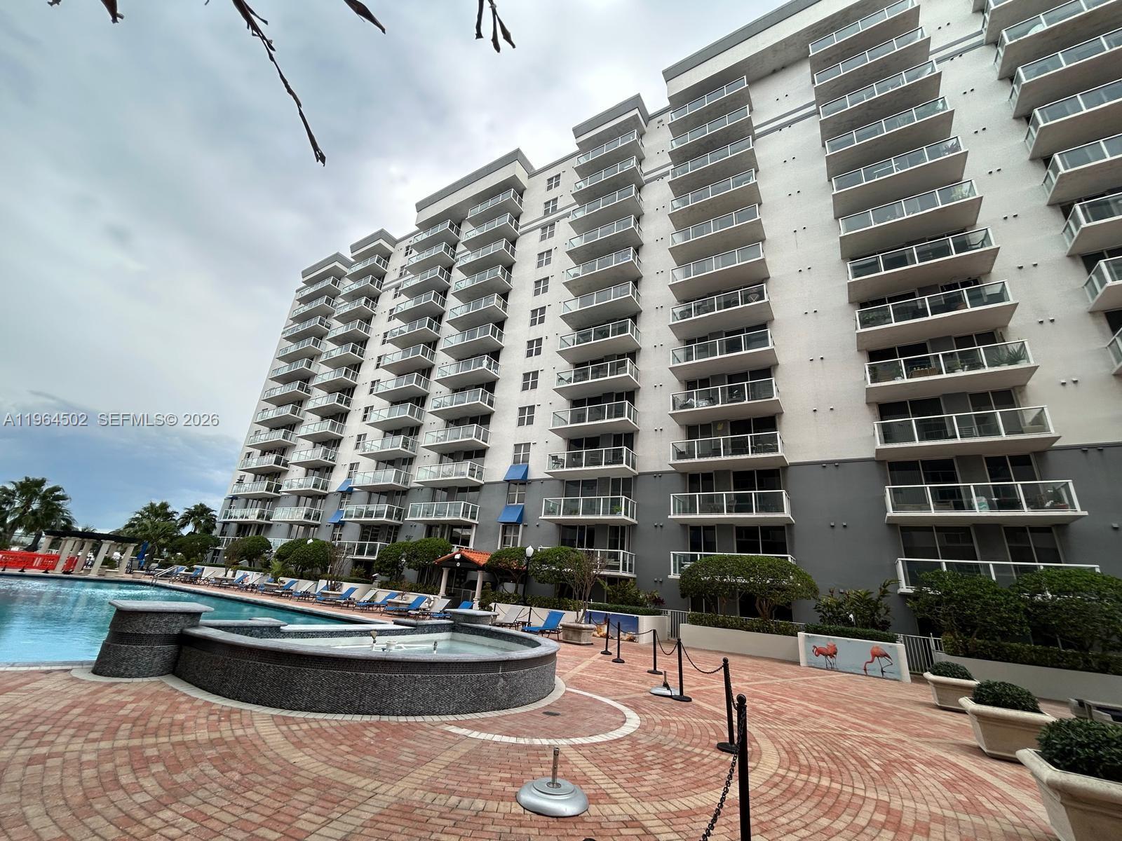 This beautiful 1-bedroom, 1-bath apartment has been tastefully updated and features impact glass for added peace of mind. Located in a highly desirable community, it offers stunning water views that you’ll love waking up to. The property includes water, and residents enjoy 24-hour security in a gated, fenced complex. In-unit washer and dryer for your convenience. Enjoy access to a range of fantastic on-site amenities including a swimming pool, sauna, gym, jacuzzi, and recreational areas. A mini market on the first floor adds extra convenience for daily essentials.