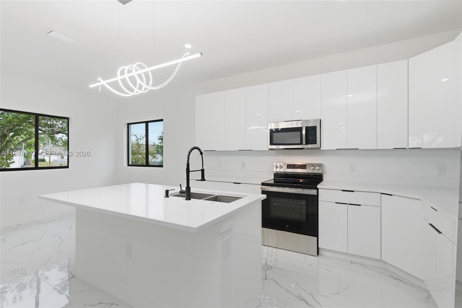Welcome to this beautifully crafted new construction home located in the desirable residential neighborhood of Mirror Lakes. This thoughtfully designed property offers 3 spacious bedrooms and 2 full bathrooms, blending modern style with everyday comfort.

The home features a contemporary kitchen with sleek modern cabinetry, stainless steel appliances, and a striking modern light fixture above the kitchen island, perfect for both daily living and entertaining. Impact hurricane-rated doors and windows provide peace of mind while enhancing energy efficiency.

Enjoy outdoor living with ample patio space, highlighted by a mature shade tree, ideal for relaxing, hosting gatherings, or enjoying Florida evenings. Additional features include a 2-car garage, a spacious laundry room, and the rare advantage of no association, offering flexibility and freedom.

This open floor plan home combines modern finishes, quality construction, and a quite neighborhood setting; an excellent opportunity for homeowners seeking style, comfort, and convenience.