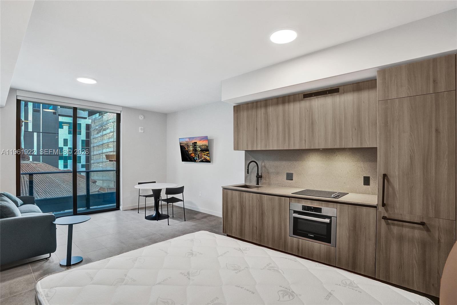 Unit 807 Studio Turnkey investment opportunity at 501 First Residences, a modern Downtown Miami building allowing daily rentals with no minimum restrictions—ideal for short-term rental investors. Unit 807 is a well-designed studio residence offering 447 SF (42 m²) with an efficient open layout, floor-to-ceiling impact windows, and a private balcony providing natural light and urban city ambiance. Delivered fully furnished with blinds and sofa bed, this unit is ready for immediate rental income. The residence also includes a storage provided by the association, adding additional convenience and flexibility for owners and guests. 501 First Residences offers resort-style amenities, co-working spaces, fitness center, social lounges, and prime walkability to Miami Worldcenter, Brightline Station, Bayfront Park, dining, entertainment, and major transportation corridors. An ideal plug-and-play investment in one of Miami’s fastest-growing short-term rental markets.
