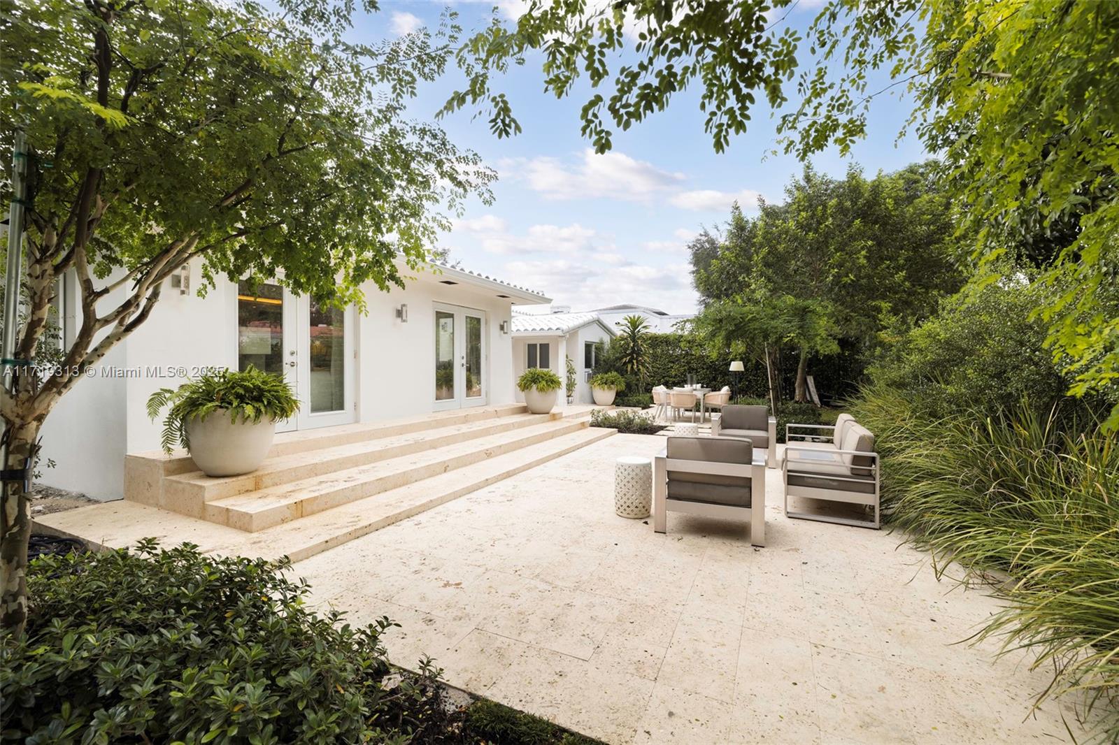 This stunning Coral Gables home features a perfect blend of modern design and timeless elegance. Vaulted ceilings and an open floor plan create a sense of space and light. The home boasts impact windows, wood laminate flooring, and custom built-out closets. The gourmet kitchen includes Thermador appliances and Taj Mahal Quartzite countertops. The bathrooms have been renovated with high-end finishes and electric toilets for added luxury. Outdoors, enjoy a private 10,000 sq ft lot with a Florida Coral Stone terrace and beautiful landscaping. A refreshed exterior, a new barrel clay tile roof, and a 1-car garage add convenience and style to this exquisite​​‌​​​​‌​‌​​​‌‌​​​‌‌‌​​‌​​‌‌​​​​ home.