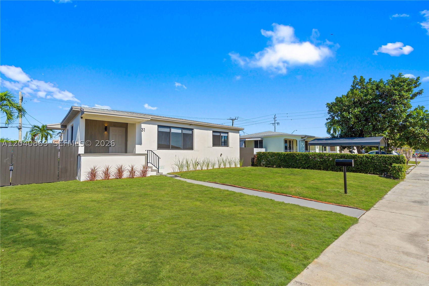 Beautifully remodeled 3-bedroom, 2-bathroom home featuring an open, airy layout enhanced by oversized windows and abundant natural light. Renovated in 2025, this move-in-ready residence offers spacious living areas, a modern kitchen with sleek cabinetry, stainless steel appliances, light oak plank flooring, and stylishly updated bathrooms. Generous bedrooms include walk-in closets, providing ample storage and comfort. Major upgrades include a NEW ROOF, IMPACT WINDOWS & DOORS, HVAC system, electrical, and plumbing for added peace of mind. Situated on a spacious, fully fenced lot offering complete privacy, with plenty of ROOM FOR A POOL, BOAT, RV OR FUTURE EXPANSION.  Ideally located near shopping, dining, major highways, and within walking distance of Amelia Earhart Park.