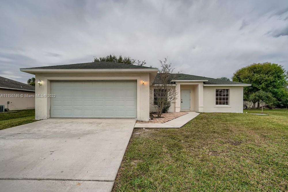 Welcome to your beautiful 3 bedroom, 2 bathroom home centrally located in Port St. Lucie! A spacious and naturally bright living room invites you into the home, an excellent space for entertaining guests. Continue through to the classic kitchen with wood cabinetry, durable countertops, a pantry, and an eating nook. The primary bedroom offers ample space with generous closet space and an en suite bathroom. Get ready to spend a lot of time in the fenced-in backyard with a patio that provides another excellent space for gatherings. The home is in a fantastic location nestled between Florida’s Turnpike and Highway 1 and is just minutes away from several shops, restaurants, and Port St. Lucie Botanical Gardens!
