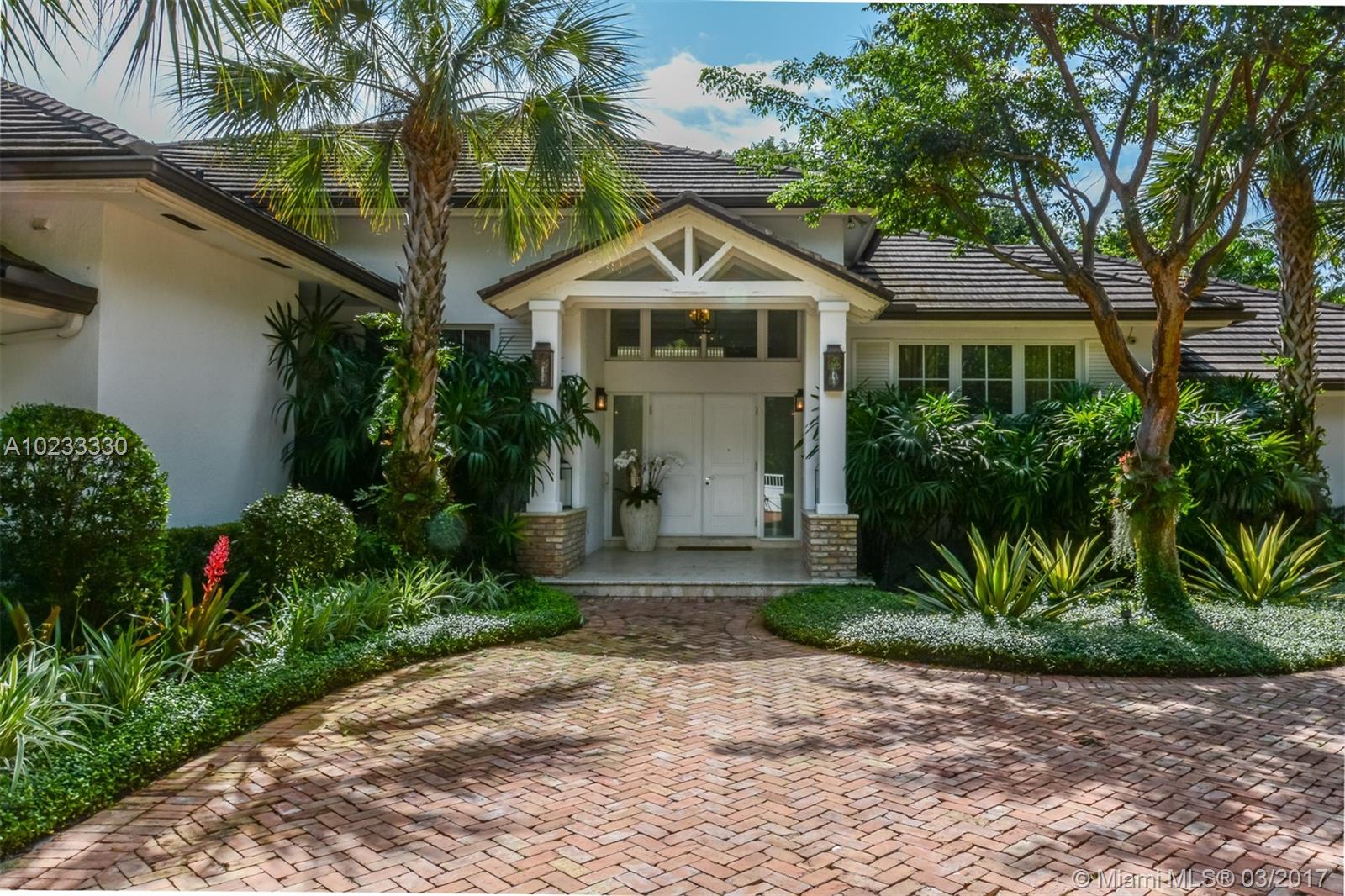 Tropical Florida architecture set on beautifully landscaped garden in exclusive Hammock Lakes gated community.  Main house has 5 bedrooms all en-suite, pool bathroom, plus guest bath.  Separate guest suite. 
Large living room with high coffered ceilings, formal dining room, large kitchen with top of the line appliances, breakfast room.  Family room with fireplace.   Exquisite architectural details throughout.  This home has been meticulously renovated and maintained. 24 hr notice to show.