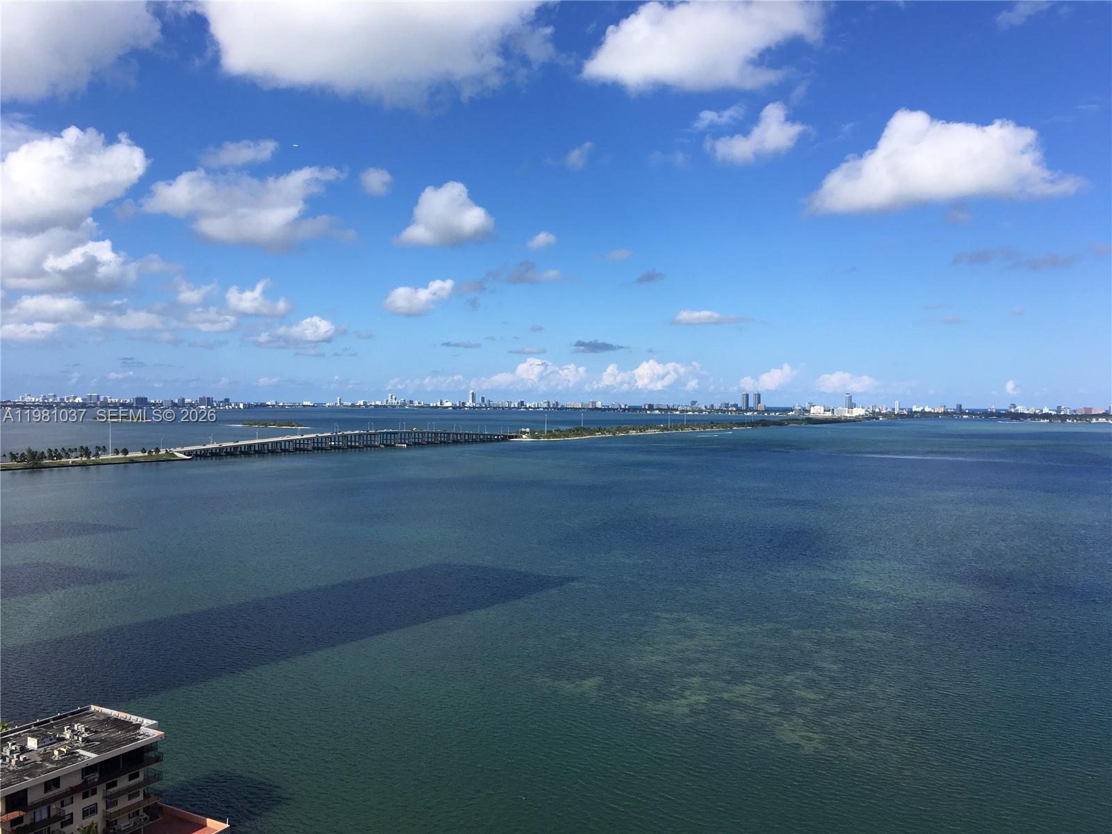 Picturesque view of Biscayne Bay!!! This majestic waterfront two story penthouse features floor to ceiling windows, higher ceilings, contemporary Italian kitchen cabinetry, quartz counter tops, Bosch stainless steel appliances, amazing shower and so much more. Amenities includes pool deck, landscaped promenade, sundeck, hot tub, outdoor/indoor, mini-theater, cyber cafe, lounge, BBQ area, a business center, state-of-the-art fitness center, yoga room, 2 parking spaces, High-tech controlled security access throughout the public and common areas, wall sound insulation, high impact windows and sliding glass doors. Huge rooftop terrace with summer kitchen and hot tub. This is definitely the place to live large and call home!