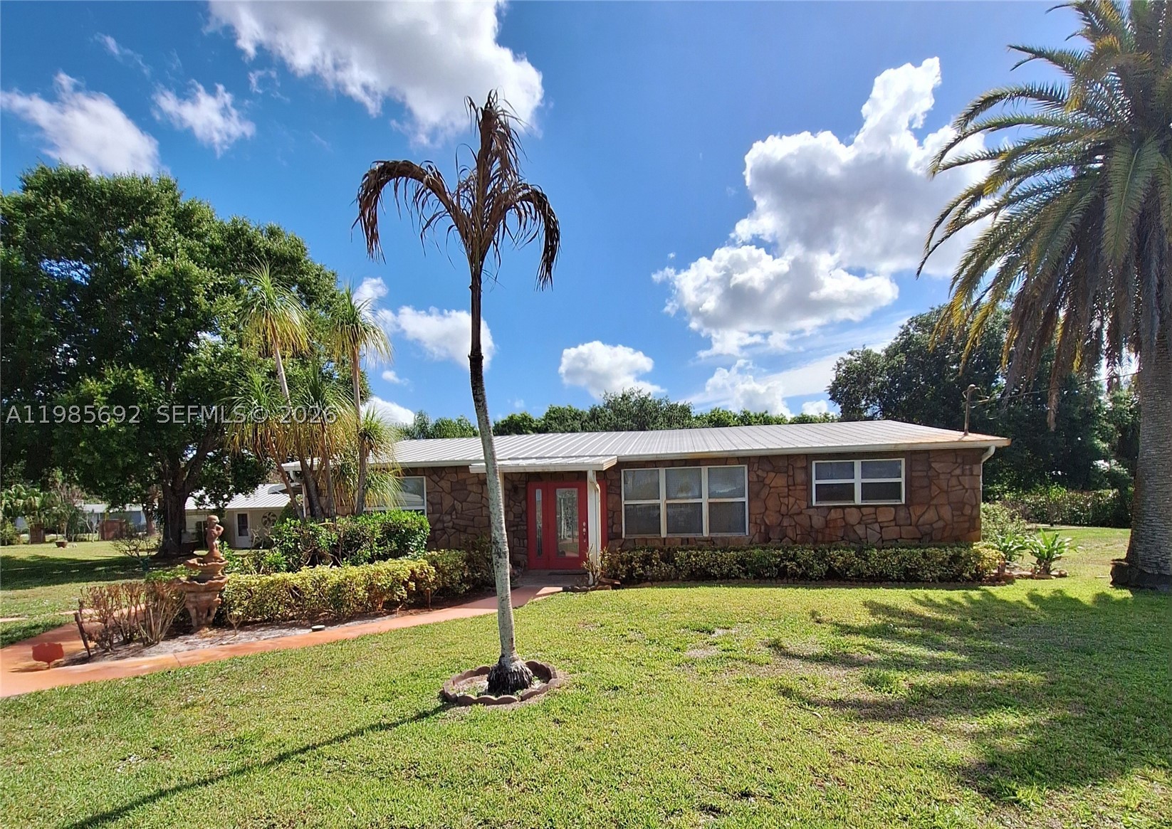 *ESTATE SALE* Your private Oasis , close center of Stuart. This 1.82-acre Single family agriculturally zoned estate, fruit trees and garden.  The main home offers 2 bedrooms, 2 baths, hurricane windows, and 1,900 sq. ft. under air — built in 1958, Large Quonset hut 25 x 40 (garage) A spacious workshop with electric.A separate guest house provides a comfortable 1 bed, 1 bath layout with 960 sq. ft. under air — perfect for visitors, extended family, or rental income ,rented for $1200 monthly Lot size 258x307    **estate sale**