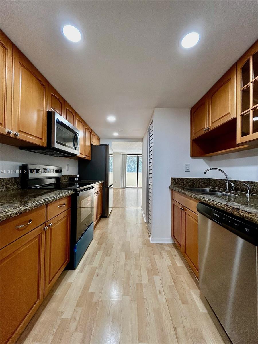 Welcome to this spacious, updated 2BR/2BA condo in the heart of Plantation, just renovated & freshly painted.  Kitchen with granite counter, bright breakfast nook and brand new appliances including washer & dryer, range and dishwasher, plus a 2-yr refrigerator and 3-yr A/C & water heater. Garden view balcony and large walk-in closets.  In addition to the beautifully renovated unit, the building is in the process of major updates that will make it feel like new: a newly installed roof in 2026, elevator modernization underway and exterior painting.  Community offers gated entry, pool, playground, 2 assigned parking spaces and ample guest parking.  Strong building reserves.  All ages welcome.  Excellent location with easy access to highways, near malls, dining, 15 min to Sawgrass Mall and just 20 min to Fort Lauderdale beach.  Come enjoy the best of the Florida Lifestyle!!
