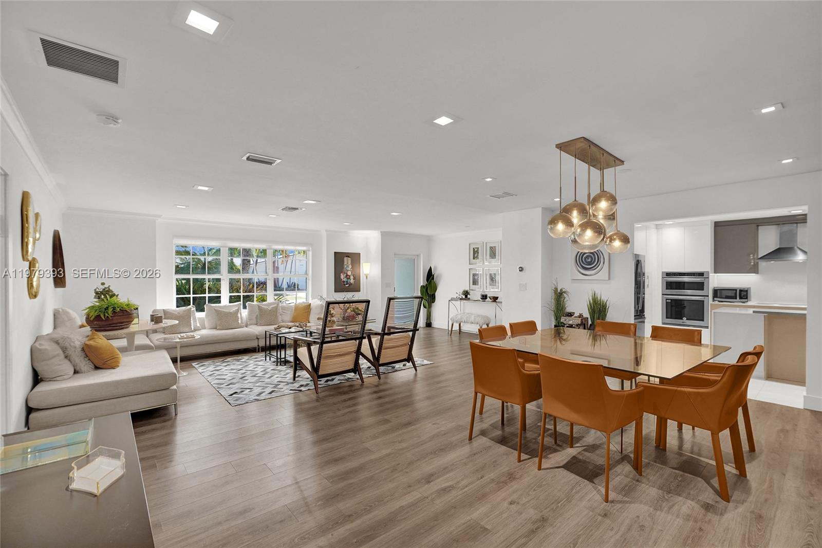 Welcome home to this beautifully renovated 4-bedroom, 3.1-bath residence situated on a desirable corner lot in the charming Enchanted Lakes community, just next to Aventura and only minutes from the beach and major airports. This home showcases high-end contemporary upgrades throughout, including wood floors, a gourmet chef’s kitchen, and fully updated bathrooms. Beyond the aesthetics, the home has been thoughtfully improved with major system upgrades such as a new roof and impact resistant windows throughout, electrical system, appliances, and sprinkler system. Step outside to enjoy your own private retreat featuring a heated pool and jacuzzi surrounded by lush tropical coconut trees. Additional highlights include an impressive circular driveway, all located on a peaceful, tree-lined street.