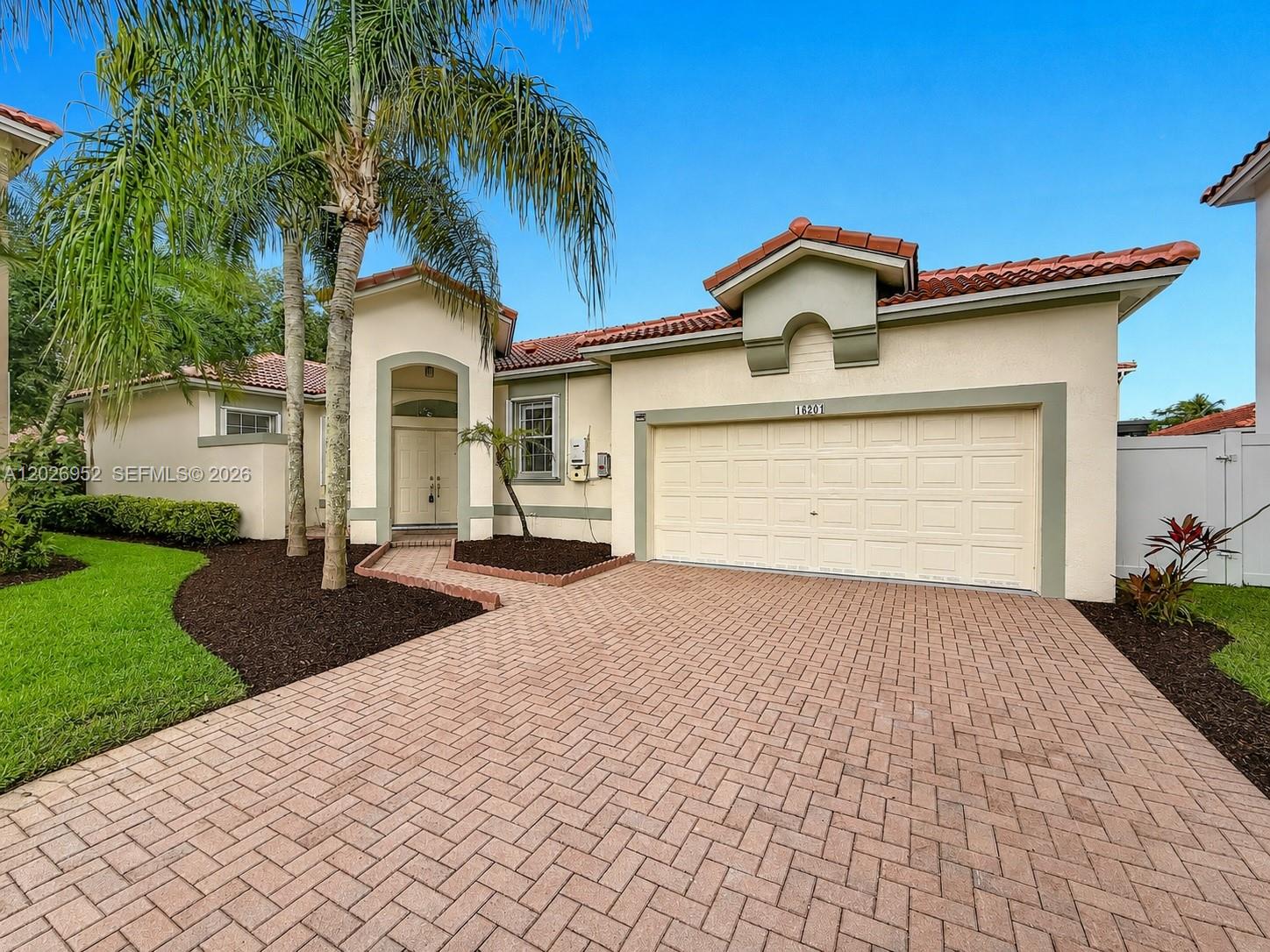 Beautifully upgraded and energy-efficient one-story home located in the gated community of Opal Creek in Weston. This move-in ready residence features a NEW ROOF installed in 2024, solar panels, freshly painted interior and exterior, upgraded designer lighting throughout, refreshed bathrooms, upgraded patio flooring, blackout window treatments, freshly painted garage, serviced A/C system, and modernized low-maintenance landscaping. Spacious split-bedroom floor plan with vaulted ceilings, abundant natural light, excellent indoor-outdoor flow, and room for a pool. Quiet cul-de-sac location near top-rated Weston schools, parks, shopping, dining, and major highways. A rare opportunity to own a thoughtfully updated home with major capital improvements already completed. Property landscaping may differ slightly from photos due to seasonal and maintenance changes.