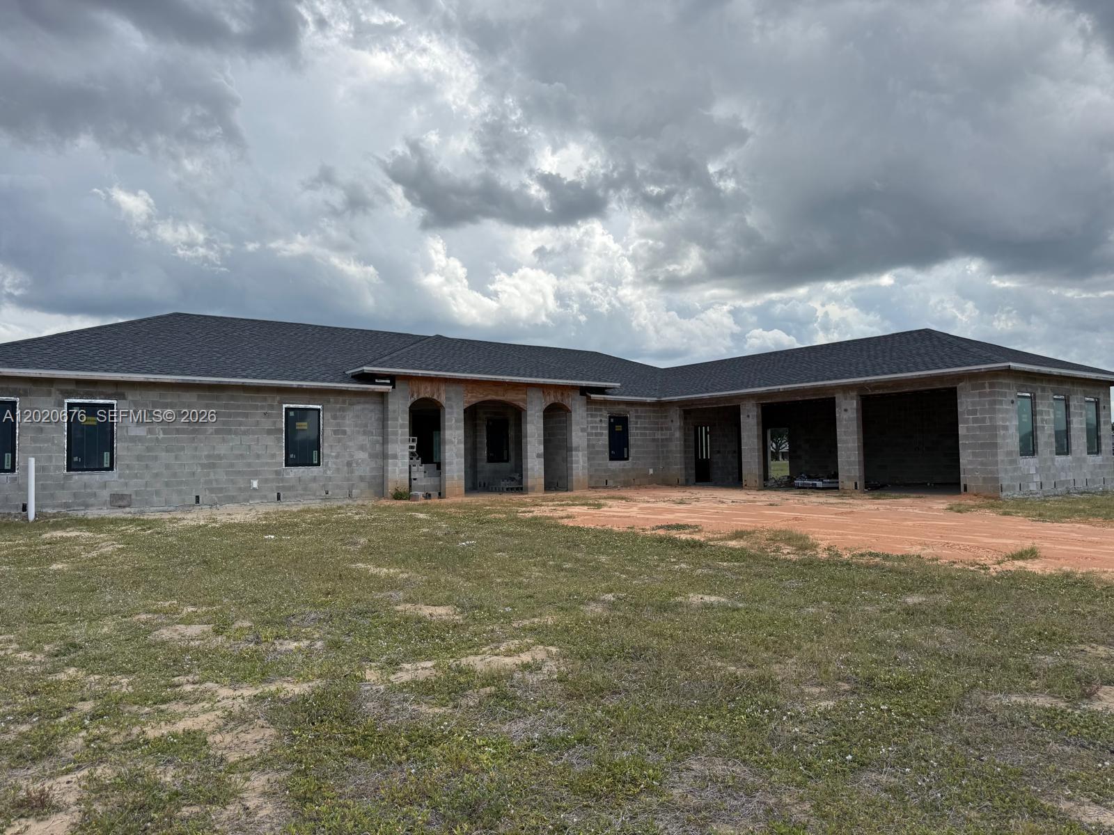 Huge 1.8 acre lot in one of the most desired private gated communities in Lake Placid Fl. This single family home with 4 beds/ 4 bath 4180 sq ft is under construction. The owner has already completed roof/windows, rough plumbing/air conditioning and electric. Concrete block /septic instillation and more. The buyer will need to complete the build and property is sold as seen. Full set of plans will be given to the buyer along with all the information the seller can provide. This is a great opportunity to take over a project or invest with great potential and build your dream home.