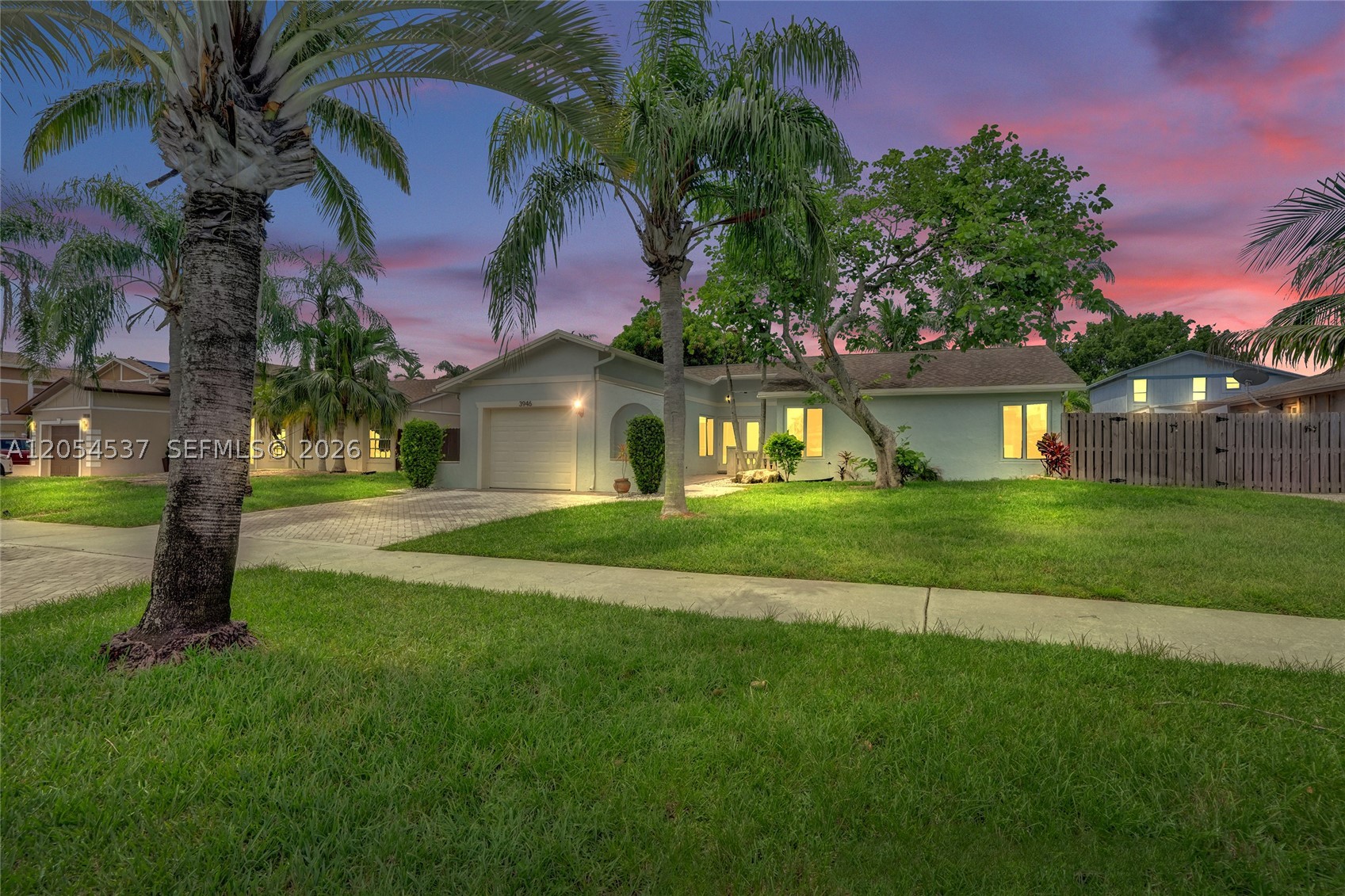 WARNING: You may never want to leave this backyard! Sunshine, palm trees, and a beautiful salt water pool with your name on it! Huge fenced-in back yard, paved patio, pool table, and outdoor shower. Inside, you will find a bright, inviting layout designed for comfortable living and entertaining. Built for convenience and efficiency, this home features hurricane impact windows and solar panels to help you save money! Don't wait and regret it later!!!