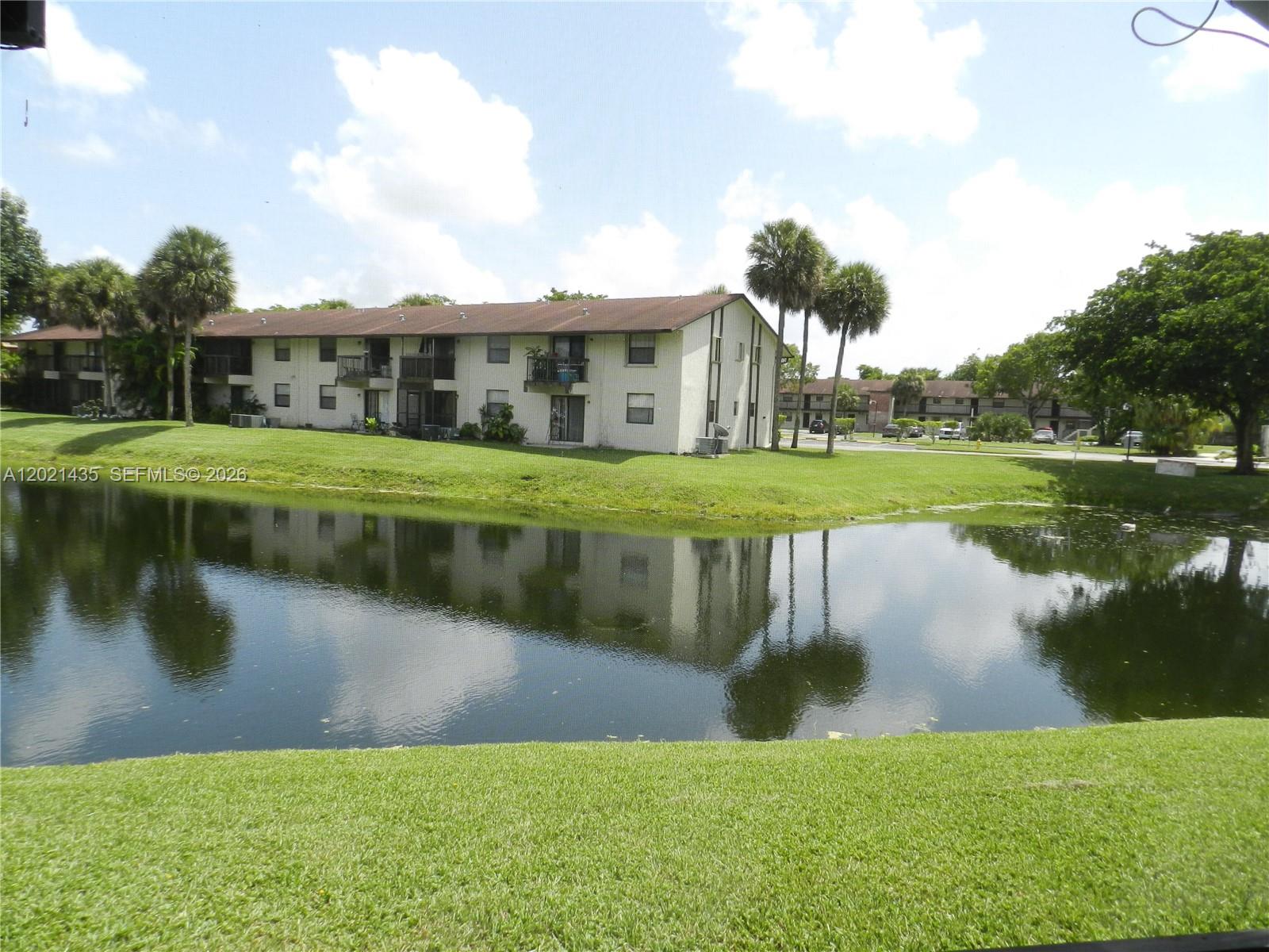 Bright and spacious. This 2 bedrooms 2 bathrooms 775 Sq. Ft. apartment is located in Tamarac. This beautiful unit features tile flooring throughout, an open concept kitchen overlooking the living area, creating a seamless and inviting space. Enjoy plenty of natural light. Granite countertop. Private balcony with relaxing lake views and functional layout that integrates all living spaces. The kitchen is fully equipped with stove, oven, dishwasher, refrigerator, garbage disposal, and everything needed for comfortable everyday living. Washer and dryer inside the unit. AC. Water heater. Shaker Wood Village private Condominium is close to shopping, dining, and public transportation. Amenities include club house and pool. Tenant occupied.