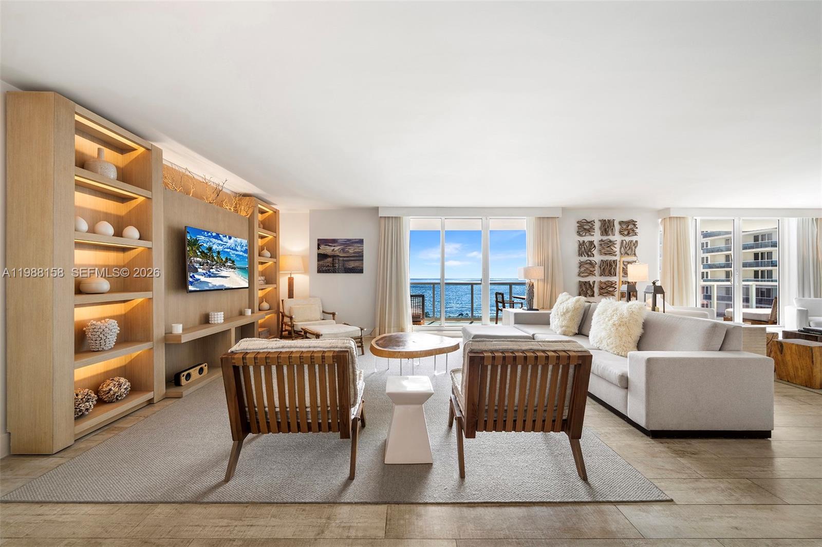 Malibu meets Miami Beach in this bespoke oceanfront three-bedroom, three-bathroom residence at 1 Hotel & Homes South Beach. A thoughtfully enhanced floor plan expands the living area offering an  impressive double-width great room, creating a perfect setting for refined entertaining.  The light-filled interiors span 2,092 square feet curated by Meyer Davis Studio and complemented with custom furnishings from Debra Aguiar. A generous terrace captures stunning sunrises and unobstructed ocean views, enhancing the residence’s effortless indoor-outdoor connection. Ownership offers the rare flexibility of optional short-term rental participation or full-time occupancy. Residents enjoy a full suite of resort-style amenities, including a dedicated car service, oceanfront rooftop pool and restaurant, Anatomy fitness center, Bamford Spa, and an exclusive beachfront experience. Discover a property defined by exceptional service and lifestyle.