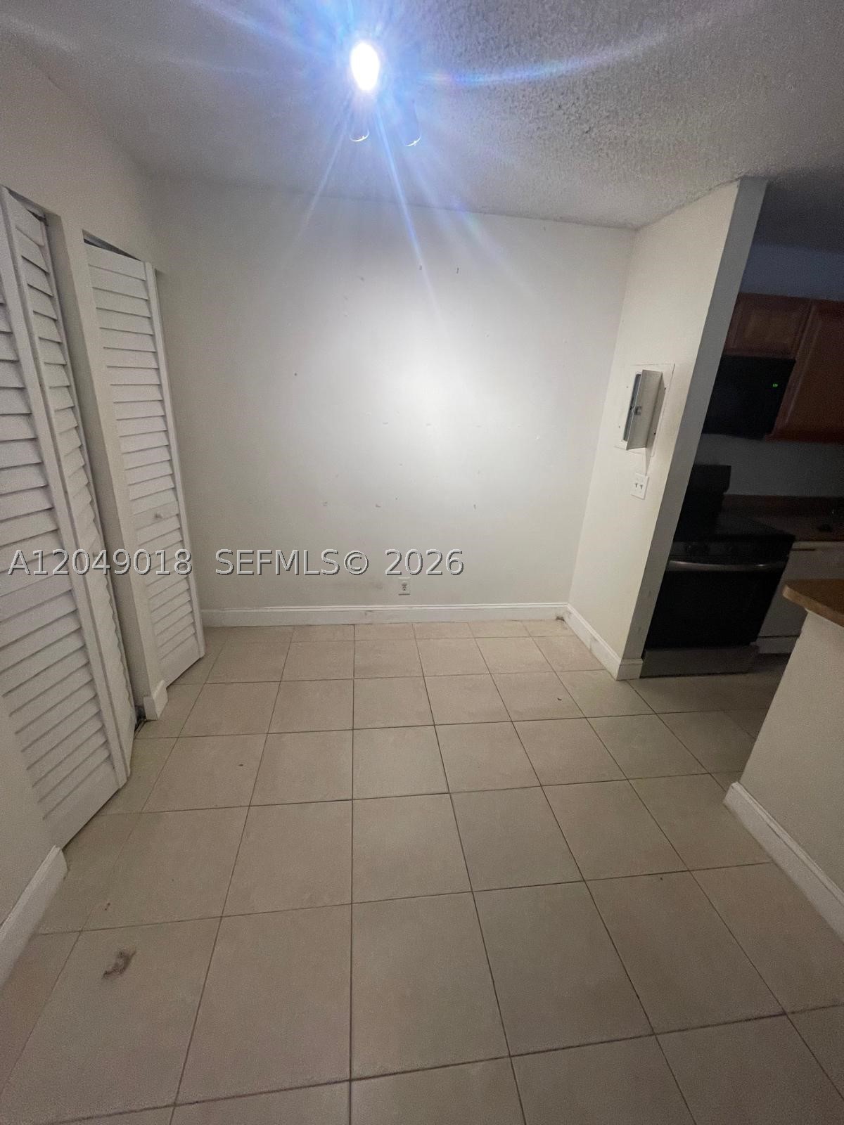 Spacious 2-bedroom, 2-bathroom first-floor condo in the sought-after Lakes of Jacaranda community in the heart of Plantation. This unit features tile flooring throughout, a well-equipped kitchen with stainless steel range, built-in microwave, dishwasher, and refrigerator with ample cabinet storage and a pantry. Both bedrooms offer generous closet space, including a walk-in closet. The unit includes a private patio and a dedicated outdoor laundry area with a stacked washer and dryer. Residents enjoy access to resort-style amenities including two pools, a heated Jacuzzi, fitness center, lighted tennis courts, BBQ and picnic areas, a lakefront walking trail, and a clubhouse — all within a beautifully landscaped, pet-friendly community. Conveniently located minutes from I-595, I-75, the Turnpike, top-rated schools, shopping, and dining.