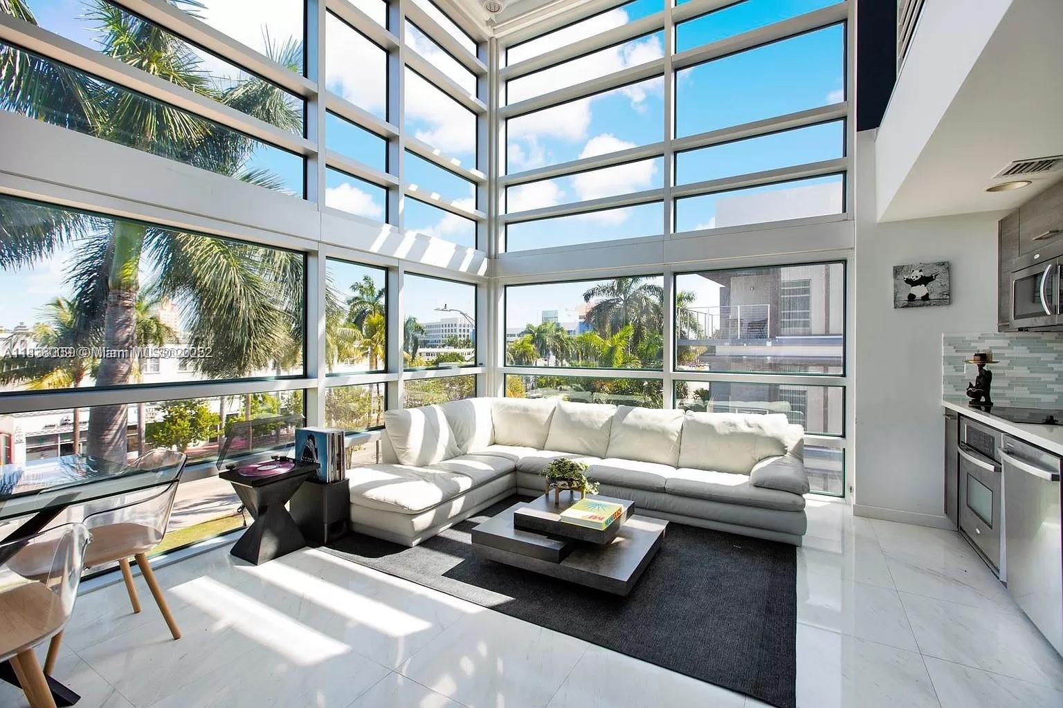 Attention Investors! Three-level penthouse with private terraces and 360° views in the exclusive South of Fifth. Brand new L-shaped staircase. Soaring 20-foot ceilings fill the living area with natural light. Modern kitchen with stainless steel appliances and quartz countertops. One bedroom + full bath on the main level, primary suite with private terrace on the second, and rooftop terrace on the third. Boutique building with only 20 units and a sun-filled pool. Covered parking, washer/dryer. Can be rented up to 12 times/year. Tenant occupied, rented at 6,500usd monthly