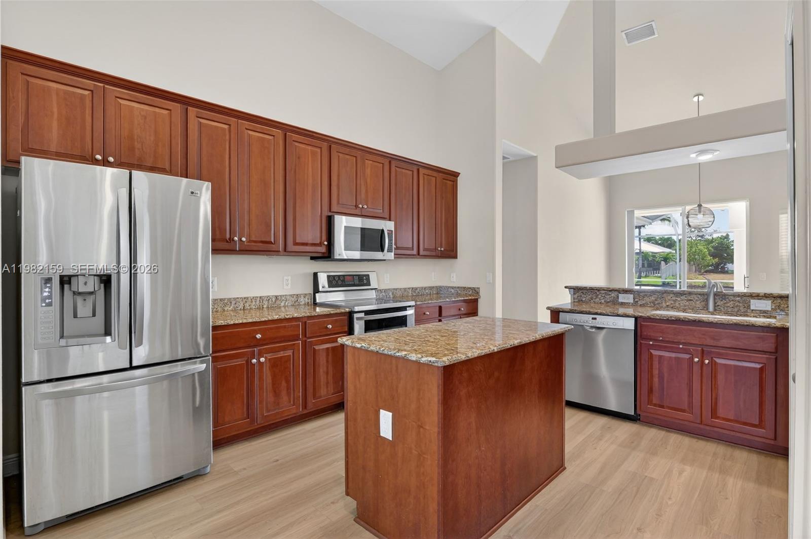 Wake up to the promise of a perfect Florida day in this exquisite 3-bedroom plus den pool home. The heart of the residence is an open-concept chef’s kitchen, featuring sleek stainless steel appliances and a central island that invites conversation and casual dining. This social hub flows seamlessly into the living areas and a versatile den, all tied together by modern vinyl flooring and framed by breathtaking water views.

Step through the sliders to a newly renovated, privately enclosed lanai—an outdoor sanctuary with a sparkling pool, heated spa, and custom outdoor kitchen designed for sunset toasts. The primary retreat offers a spa-like experience with his-and-her closets, dual sinks, a soaking tub, and a large walk-in shower. Complete with an indoor laundry room and a central location near the city’s best dining, this home is the ultimate waterfront escape.