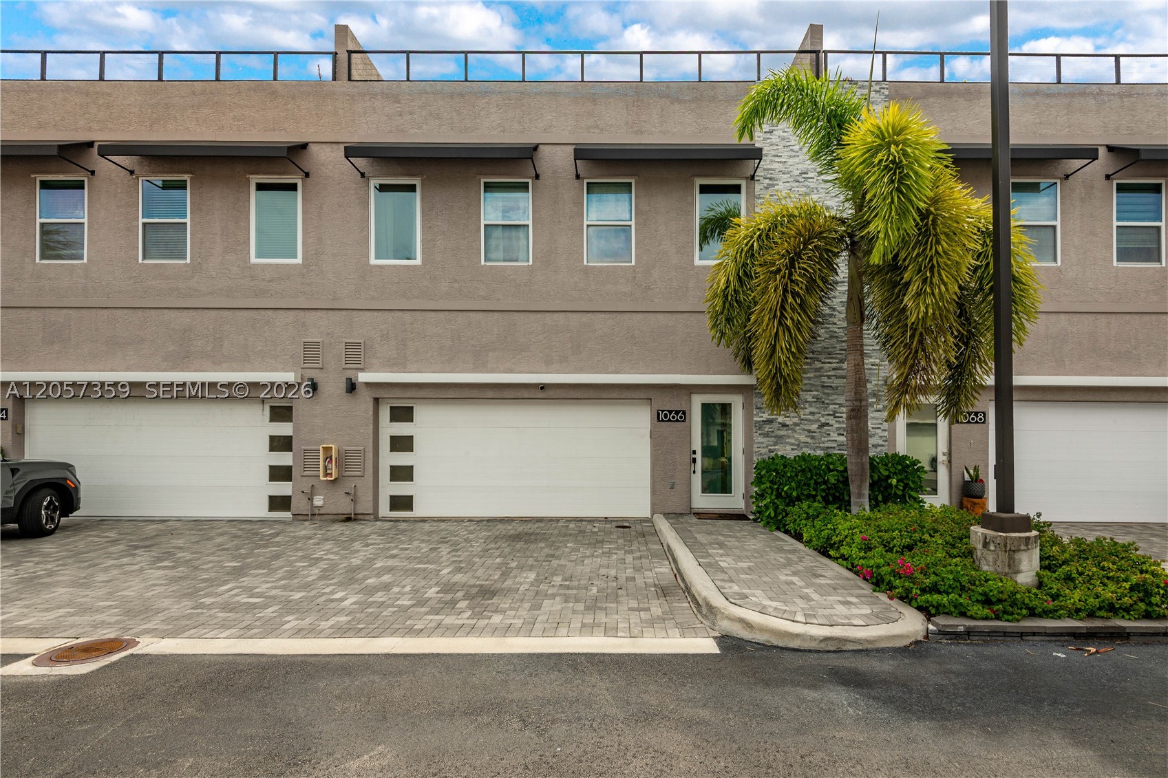 MODERN DESIGN
PRIVATE ROOFTOP

Welcome to Oakland Terrace, an exclusive community of eight modern townhomes in Downtown Oakland Park. Built in 2021, this 3 bedroom, 2.5 bathroom home offers modern design, spacious living, and a prime location. The first floor features an open concept kitchen, living, and dining area, plus a half bathroom, pantry, storage, and a private backyard with low maintenance turf. With a two car garage and driveway, the home offers parking for up to four vehicles.
Upstairs are three spacious bedrooms, including a primary suite with a walk in closet and oversized ensuite bathroom, along with a guest bathroom and laundry room.
The standout feature is the private 1,000 square foot rooftop terrace, finished with professional silicone seal and premium turf, it is an ideal space for relaxing or entertaining. 
The monthly maintenance is low and there are no pending assessments.
Located in the “Brooklyn of Broward” Oakland Park is one of South Florida’s fastest growing cities, just steps away from restaurants, breweries, parks, and shops. This is an exceptional opportunity to own a modern home in one of the region’s most vibrant and rapidly growing communities, all within a short distance of the beach and Downtown Fort Lauderdale.