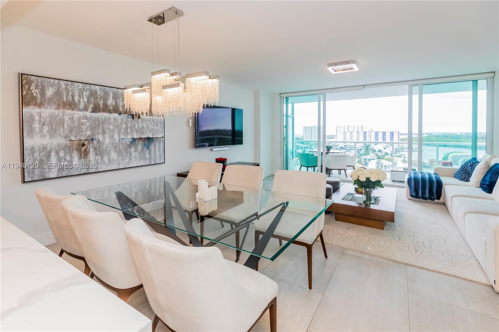 MUST SEE. BEST VIEW.. Spectacular residence at 400 Sunny Isles Condominium featuring stunning Intracoastal and ocean views. This bright and spacious unit offers an open-concept layout with floor-to-ceiling impact windows, modern kitchen with contemporary cabinetry and stainless steel appliances, and elegant finishes throughout. Enjoy water views from the private balcony. The primary suite includes a spa-style bathroom and ample closet space. Resort-style amenities include marina with boat slips, two pools, fitness center, spa, tennis courts, concierge, and 24-hour security. Prime location minutes from the beach, dining, shopping, Aventura Mall, and Bal Harbour.