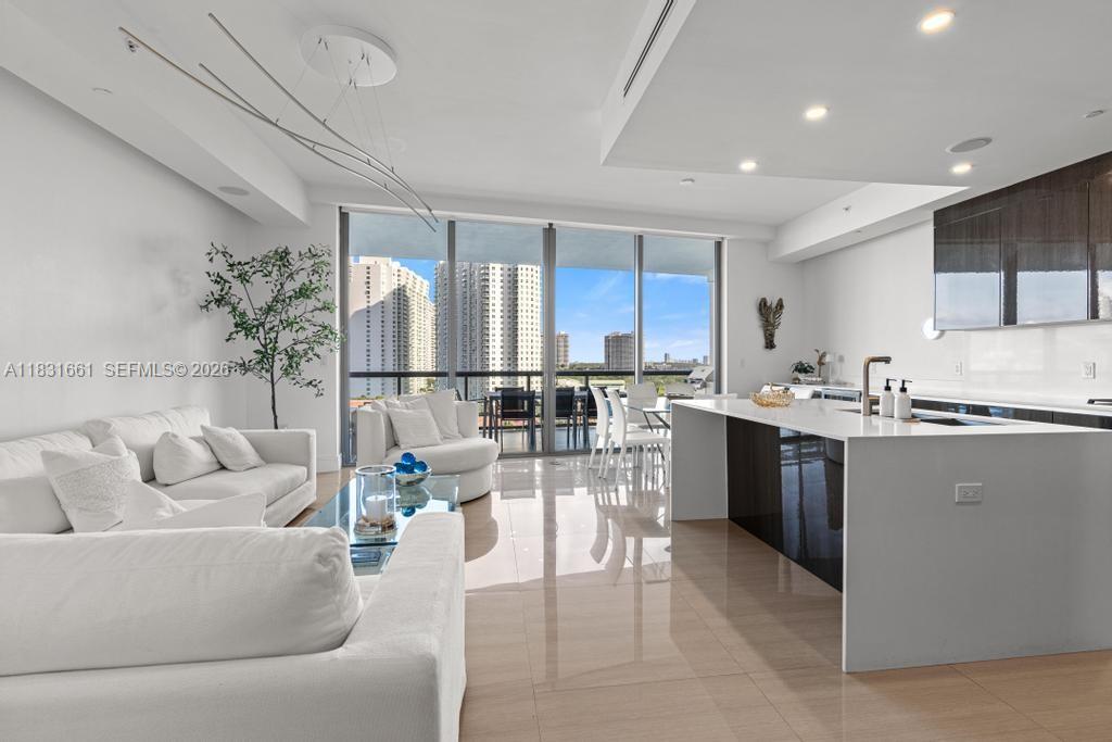Experience luxury waterfront living at Echo Aventura. This expansive corner residence features 3 bedrooms plus staff quarters and 4.5 bathrooms, offering breathtaking ocean and Intracoastal views from every angle. The elegant interior showcases marble and wood flooring, a contemporary Italian kitchen with premium appliances, and floor-to-ceiling glass that fills the home with natural light. An oversized terrace with a summer kitchen provides the perfect setting for entertaining and enjoying the spectacular views.
Residents enjoy private elevator access and world-class, resort-style amenities, including a state-of-the-art fitness center, spa, yoga studio, on-site restaurant/café, poolside service, and more. The unit also includes 2 assigned parking spaces and a private storage unit. Combining luxury, location, and lifestyle, this exceptional residence represents the best of Aventura waterfront living.