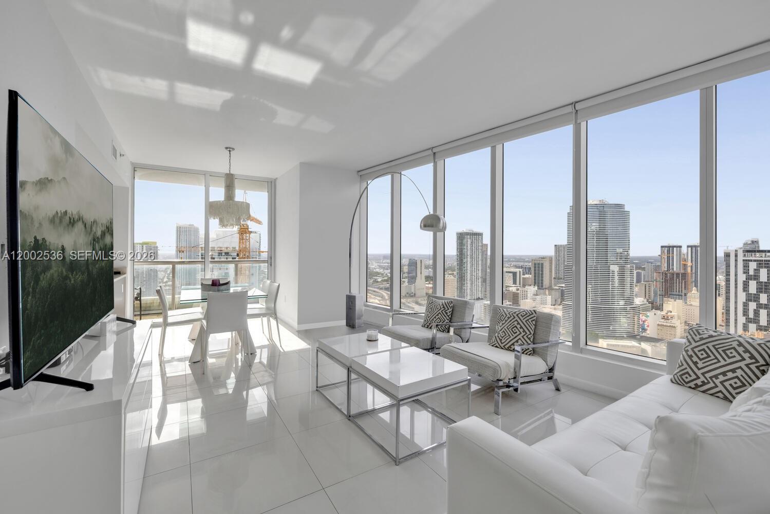 Icon Brickell Tower 3 allows flexible ownership with strong short-term and daily rental potential, making it an ideal asset for both personal use and income generation. The residence features a contemporary open floor plan with European-style cabinetry and stainless steel appliances, designed for modern living. The primary suite offers stunning water and skyline views, generous closet space, and a spa-inspired bathroom.Perched on a high floor, this residence showcases sweeping panoramic views of Biscayne Bay and the Miami skyline. Floor-to-ceiling glass fills the unit with natural light, enhancing the bright and open living space. The unit is currently rented through May 2027 at $6,700 per month, providing immediate and stable income for investors.