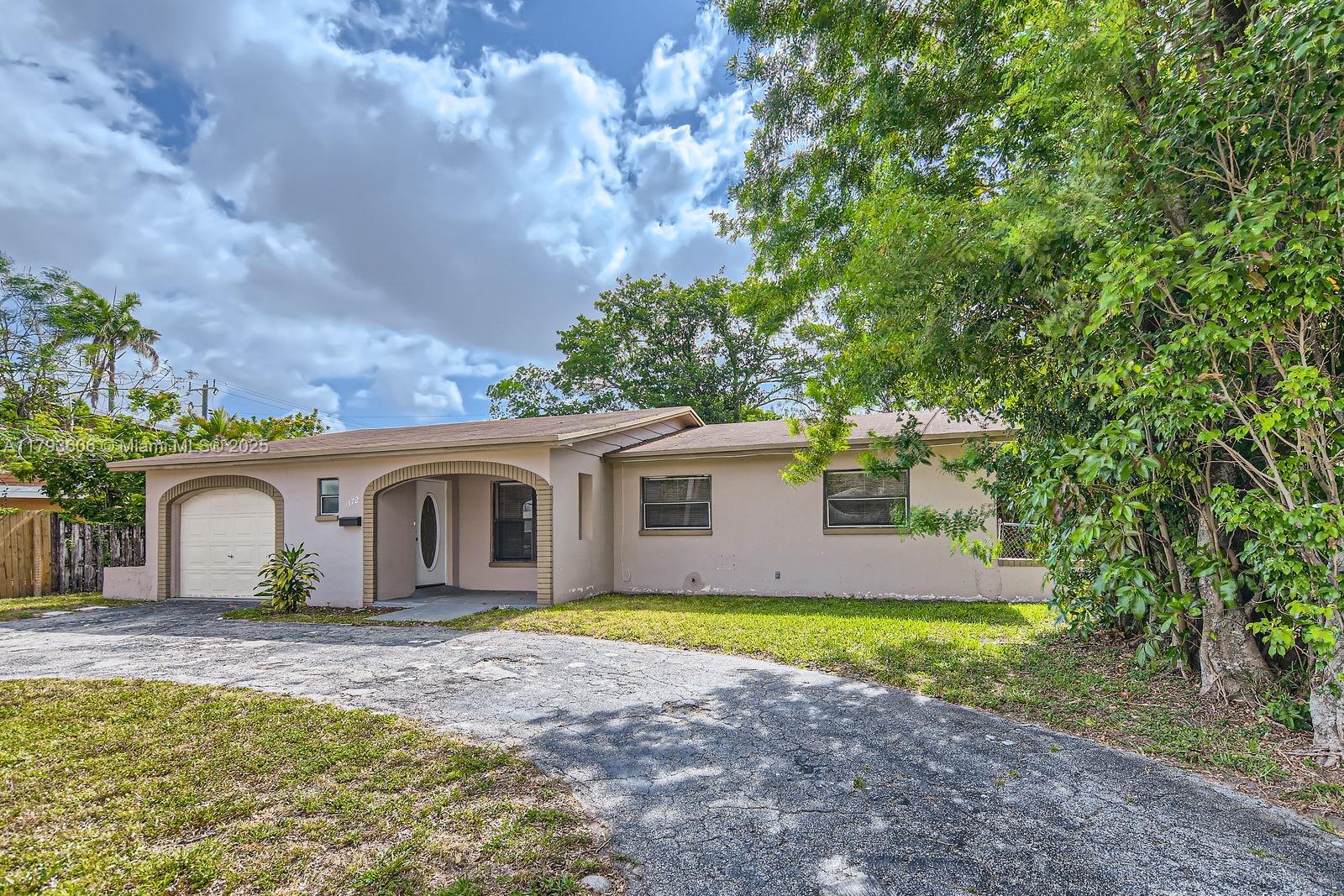 Three-bedroom, two-bathroom home with a one-car garage located in the heart of Lauderhill, Florida. The home features tile flooring throughout and a large screened-in back porch, providing a perfect additional space for relaxing or entertaining. The kitchen boasts granite countertops and white appliances, ideal for chefs of all skill levels. Enjoy the benefits of no HOA, allowing you to spend more on exploring the nearby shopping, dining, and beautiful beaches. Schedule your showing today!