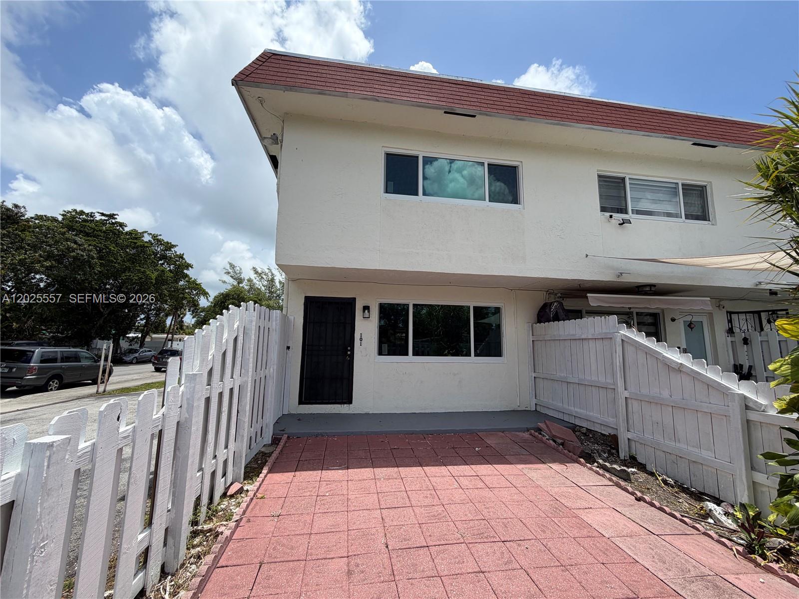Charming 2-story townhouse conveniently located at 1450 NE 151 St #101, Miami, FL. This move-in ready residence features 2 spacious bedrooms and 1 full bathroom upstairs, plus a convenient half bathroom on the first floor for guests. Enjoy a private front patio/backyard area along with an additional fenced backyard, perfect for relaxing, entertaining, or extra outdoor space. Impact windows throughout The unit includes 1 assigned parking space and offers a comfortable layout with plenty of natural light. Ready for immediate occupancy
HOA takes 1 to 2 weeks to approve and required $500 security deposit.  

Washer and Dryer hook-up (no equipment)