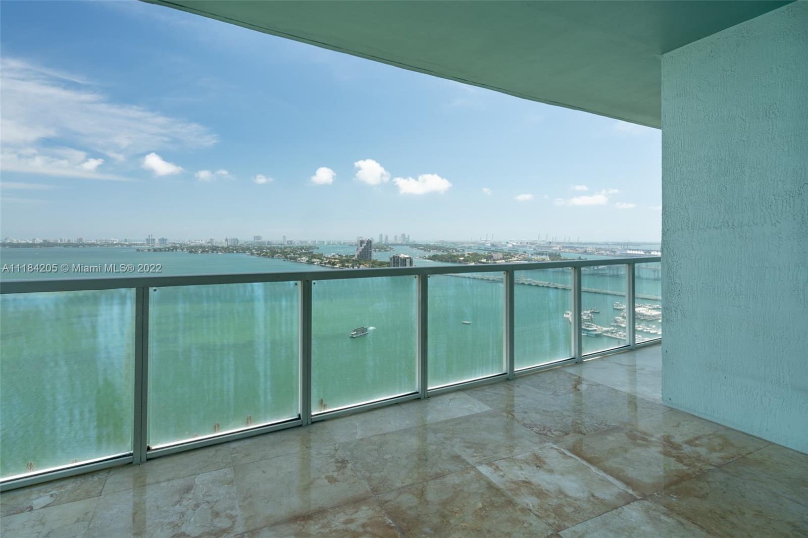 Spacious Corner Unit 2 bedroom 2.5 baths with den. Marble floors throughout freshly polished. Freshly painted. Updated appliances. Lots of closet space. washer dryer in unit. Spectacular views of bay, beaches, skyline, etc. Building has great amenities including 2 pools, large gym with every exercise amenity imaginable. Multiple common areas for relaxing and lounging. Walking distance to restaurants, food and much more. Easy commute to beaches, downtown, airports, Wynwood, Design District and more. 8 acre Margaret pace park and bay at your front door.