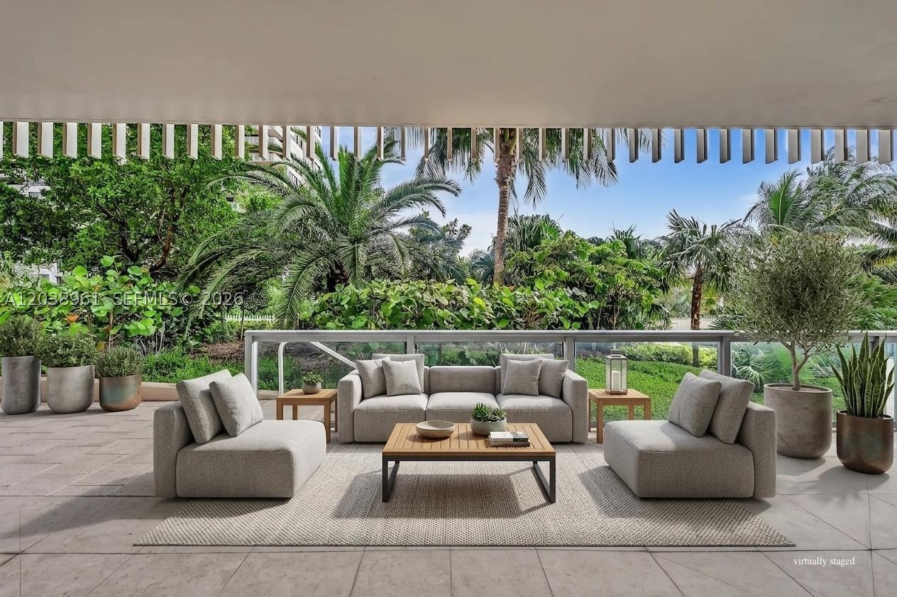 An exceptionally rare lanai residence on prestigious Grove Isle! Step directly from your expansive private terrace to lush tropical gardens and the resort-style pools—no elevator required.

Tastefully renovated and filled with natural light, this spacious 1,882-square-foot home features elegant custom built-ins, generous living and dining areas, a thoughtfully designed kitchen, and oversized walk-in closets. The large terrace seamlessly extends the living space outdoors, creating the perfect setting for morning coffee, alfresco dining, or entertaining amid lush tropical surroundings.

Nestled within the exclusive, guard-gated Grove Isle community, residents enjoy waterfront gardens and pools, a world-class racquet club, fitness center, a scenic bay-front walking path, 24-hour security, and a soon-to-open signature restaurant, all just minutes from the heart of Coconut Grove, Brickell and Downtown.