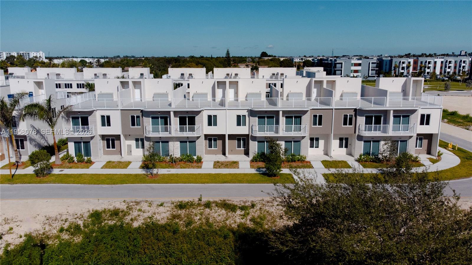 Grace Homes Townhouses Move-in-Ready modern Open Rooftop Townhouse with private balcony in the heart of South Miami-Dade. Conveniently located near US-1 and Florida’s Turnpike (Exit 6). Grace Homes is situated in the rapidly developing Naranja neighborhood with easy access to shopping and charter school options. This residence is part of a boutique community of only 32 homes. Offering 4 bedrooms and 3 full bathrooms, including a ground-level guest suite, the thoughtfully designed layout provides flexibility for families, guests, or home office needs. The home features a modern open kitchen, contemporary finishes, and porcelain tile flooring throughout—no carpet—creating a clean, sleek, and low-maintenance living space. Enjoy two parking spaces and buyer incentives including closing cost credits and a low interest rate when using the preferred lender and title company. No pet restrictions. Easy to show. No Flood requirement