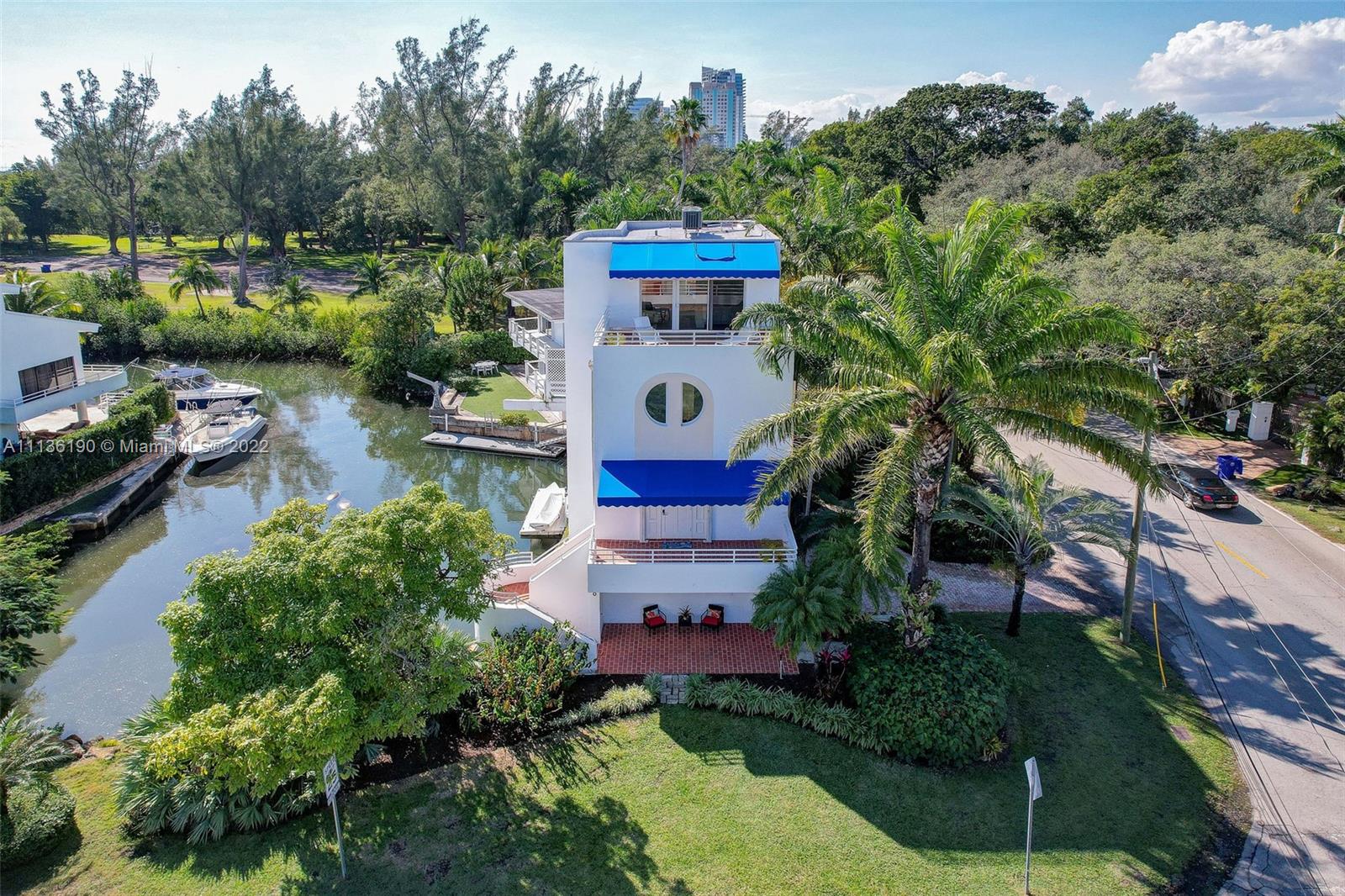 Perfect home for the water-sports & boating enthusiast's entire family! The home has private dock for paddle boards, canoe, boat & even dueling jet-skis! Enjoy Miami's outdoors!  This home is designed with Miami modern style & architecture boasting serene views of the bay & Kennedy Park. The home offers direct ocean access & is located along the canal's private cove. Observe Miami's wildlife in the cove from your kitchen window or by relaxing on the covered patio & outdoor cooking area. Short distance thru Kennedy Park to downtown Coconut Grove & enjoy shopping, restaurants, & nightlife. All BRs are en-suite + a powder room. Home outfitted w dedicated office &/or gym, 1-car garage, dock, impact windows, new roof, smart home system, & new exterior paint.