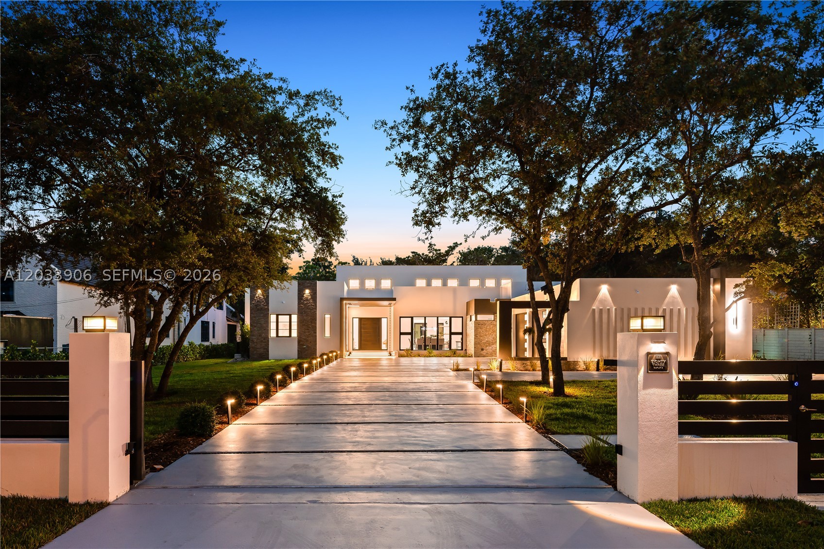 First time Open House at Eighty Three Estate 6/14 1-4PM. Newly constructed, architecturally significant gated modern estate set on a rare one-acre lot, privately positioned on a quiet dead-end street in desirable Glenvar Heights. Offering approximately 5000 sf under air (approx. 6100 total sf), this exceptional residence features 5 beds, 6 full baths & a powder room. Dramatic 20-ft ceilings with clerestory windows flood the interiors w/natural light, highlighting Porcelanosa floors & baths, a custom Italian kitchen, & a sophisticated dining room complete with a bespoke bar & wine refrigeration. The chef’s kitchen is designed to impress, featuring a 6-burner gas cooktop, double ovens, quartz countertops, & premium finishes throughout. Custom San Giacomo closets enhance both form & function. This fully integrated smart home includes a Lutron system, outdoor lighting & security cameras. An expansive covered terrace with 12-ft ceilings & a fully equipped outdoor kitchen overlook a resort-style pool & cabana—ideal for both entertaining and everyday living. Highlights include an insulated, air-conditioned spacious 3-car garage with 10-ft ceilings & space for a lift, a reinforced concrete roof, and a location outside of a flood zone. Just a short distance from the Village of South Miami, Coral Gables and Coconut Grove, this is a truly special offering—where privacy, design, and craftsmanship converge. All drawings & measurements are approximations of final home. A Very Special Home.