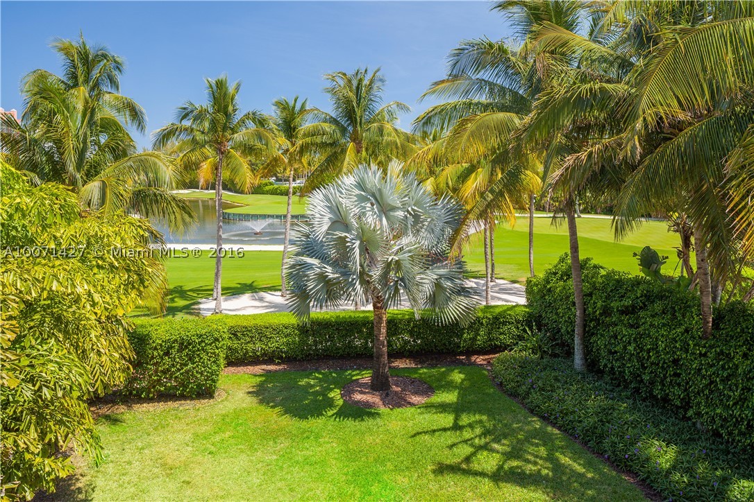 Live in your own private oasis in this spectacular fully-furnished, completely remodeled, dream home. 1 of only 8 homes on exclusive Fisher Island. This contemporary home features 5 elegantly furnished bedrooms and 5.5 beautiful bathrooms clad w/imported white quartz & marble showers. Formal LR & DR, eat-in kit w/ family room & an addl upstairs FR make this home perfect for family living or entertaining guests. Every detail throughout is finished to perfection. 3 gar,2 golf carts inc. Turn-key-A must see!