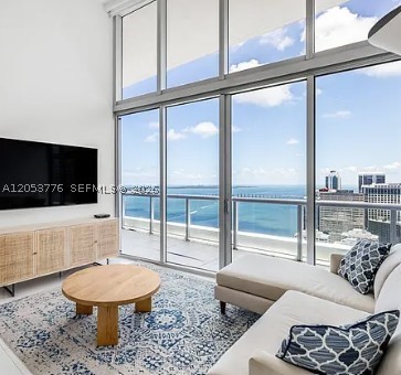 Welcome to a rare luxury residence in the heart of Brickell. Soaring 16-foot ceilings create an airy, expansive feel, while floor-to-ceiling windows frame unobstructed views of Biscayne Bay and the Brickell skyline. This thoughtfully designed 2-bedroom home sits in one of Brickell's premier condominiums, Icon Brickell — surrounded by water, a boardwalk, and two parks, and known for its oversized bayfront pool and exceptional amenities. Modern elegance, stunning views, and unmatched comfort make this a rare opportunity to own a piece of Miami luxury real estate. EASY TO SHOW