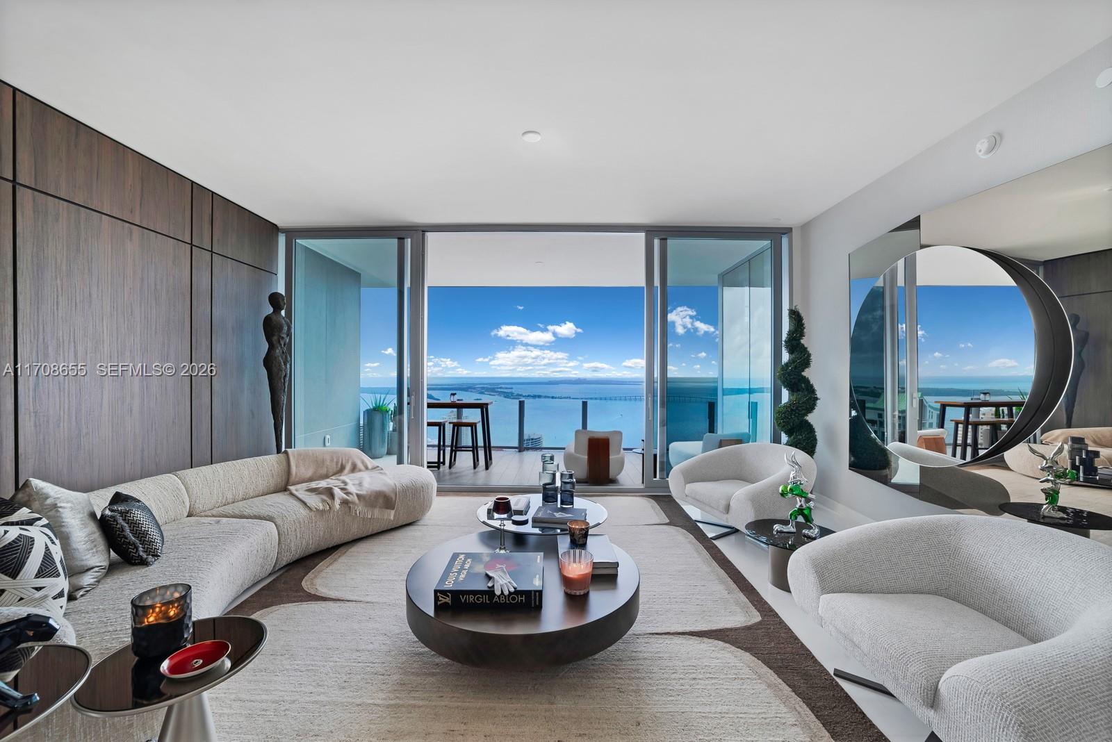 Indulge in the best views in the building & the epitome of sophistication with this brand-new 3 bedroom+Den+Family+ Staff 4.5 bathroom residence at the prestigious Aston Martin Residences. Designed to reflect the iconic elegance of the Aston Martin brand this home offers stunning views of Biscayne Bay & Miami Beach through expansive floor-to-ceiling windows & a private, spacious balcony. This residence features exceptional craftsmanship, including gourmet kitchen equipped with Gaggenau appliances, marble floors & offers an unmatched lifestyle of comfort, luxury & convenience.
Enjoy unparalleled amenities on the Sky Amenities level, offering over 42,500 sq. ft. of luxury including an infinity pool, spa, movie theater, private boat for residents' use, state-of-the-art fitness center & more.