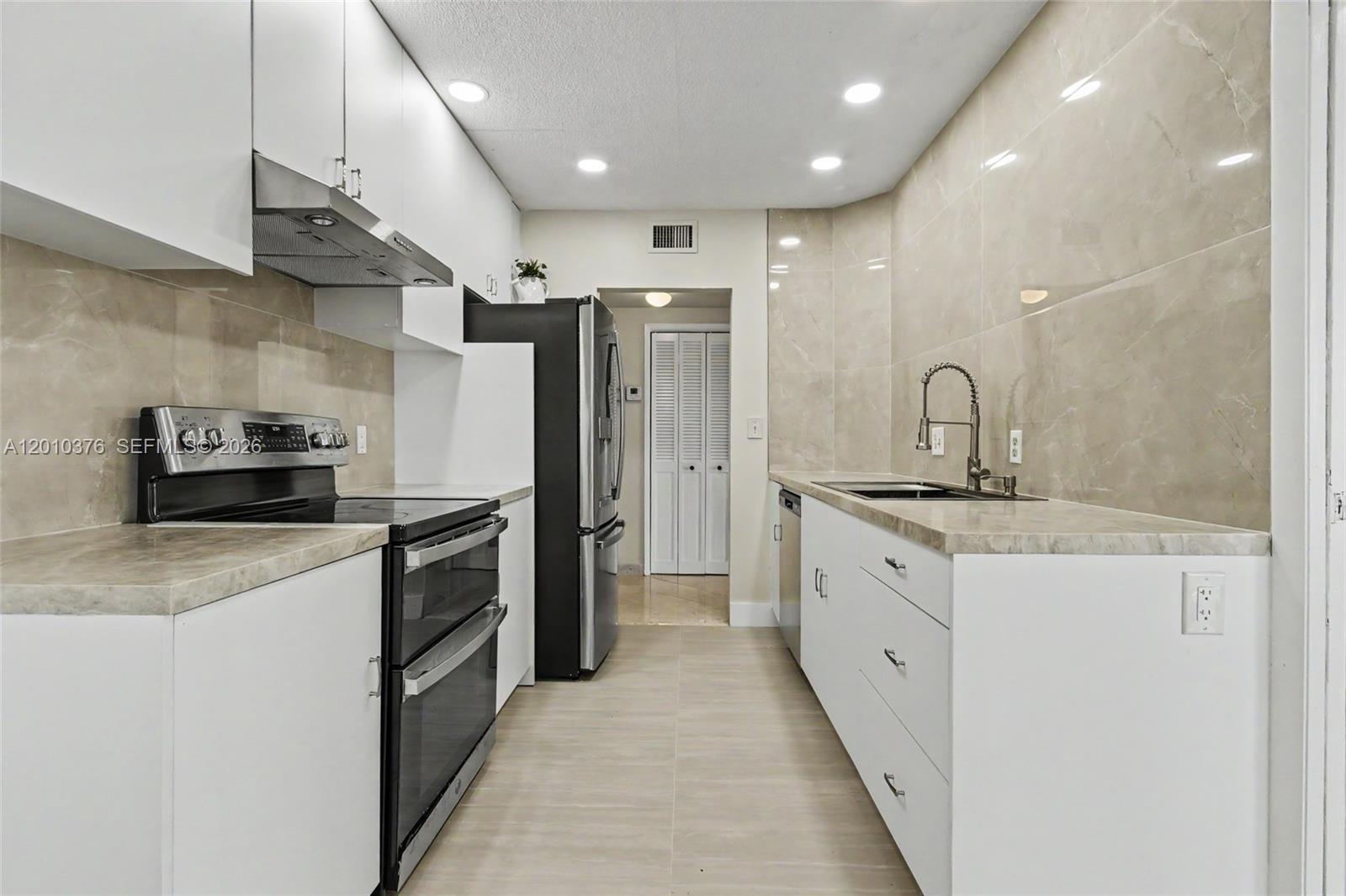 All Ages welcome!  Fabulous views from this fully renovated 2/2 corner deluxe penthouse unit.  Large white kitchen with granite countertops, stainless steel appliances and full pantry.  Extra high ceilings.  Hurricane proof windows.  Beautifully tiled throughout.  Spacious living room with wonderful city views and huge enclosed balcony which makes for a wonderful additional room for an office or bedroom.  Tastefully renovated bathrooms.  Large master suite with closets galore.  Very rare washer and dryer hook up.  Very well maintained building with 24/7 security, heated pool and hot tub, extra storage and bike room.  Hillcrest is close to shopping, dining, beaches, Hardrock Hotel and Casino, Gulfstream Park and Racing, Ft. Lauderdale Airport, all major highways and the Famous Hollywood Boardwalk.  *NO LEASING*