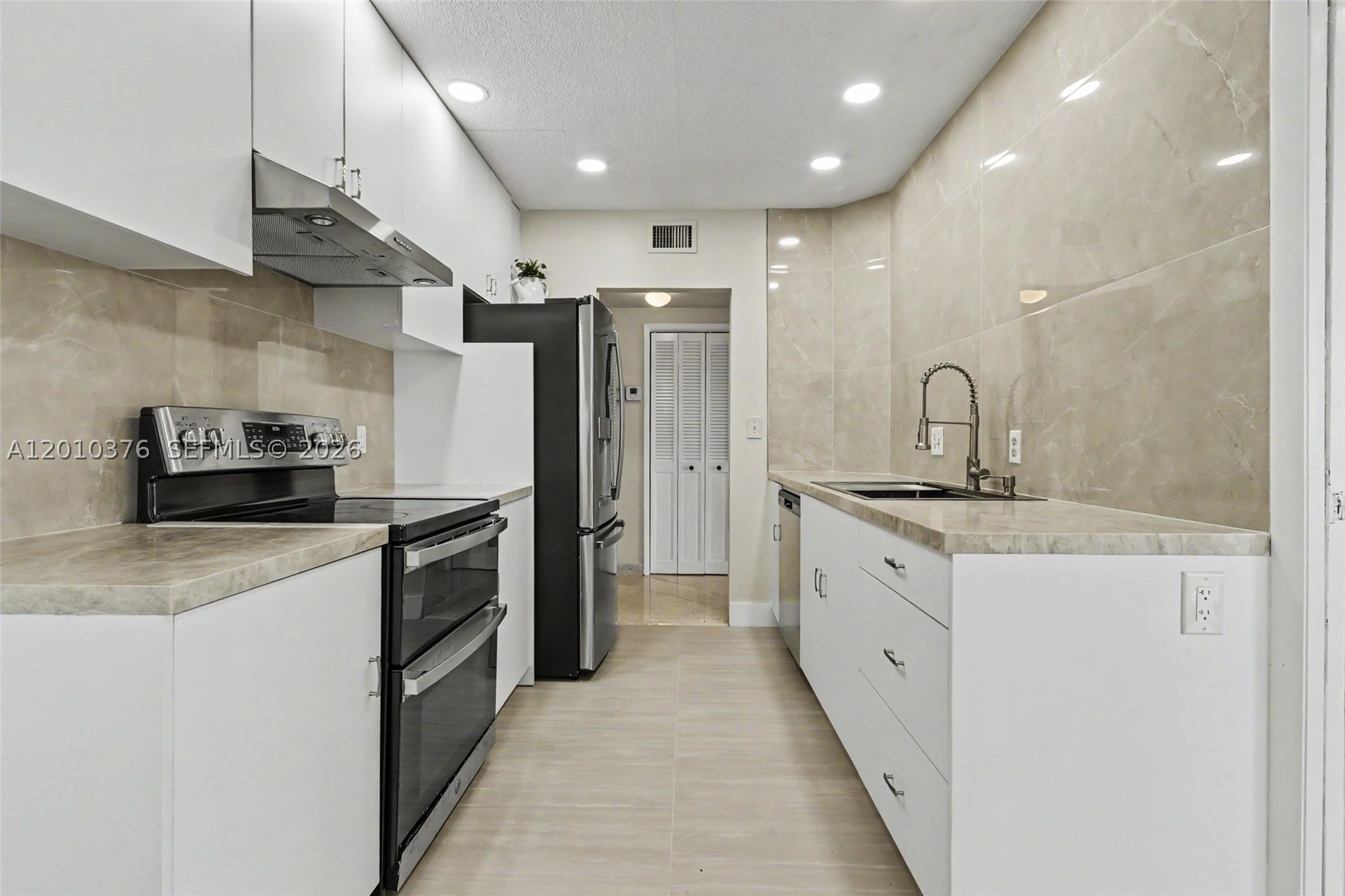 All Ages welcome!  Fabulous views from this fully renovated 2/2 corner deluxe penthouse unit.  Large white kitchen with granite countertops, stainless steel appliances and full pantry.  Extra high ceilings.  Hurricane proof windows.  Beautifully tiled throughout.  Spacious living room with wonderful city views and huge enclosed balcony which makes for a wonderful additional room for an office or bedroom.  Tastefully renovated bathrooms.  Large master suite with closets galore.  Very rare washer and dryer hook up.  Very well maintained building with 24/7 security, heated pool and hot tub, extra storage and bike room.  Hillcrest is close to shopping, dining, beaches, Hardrock Hotel and Casino, Gulfstream Park and Racing, Ft. Lauderdale Airport, all major highways and the Famous Hollywood Boardwalk.  *NO LEASING*