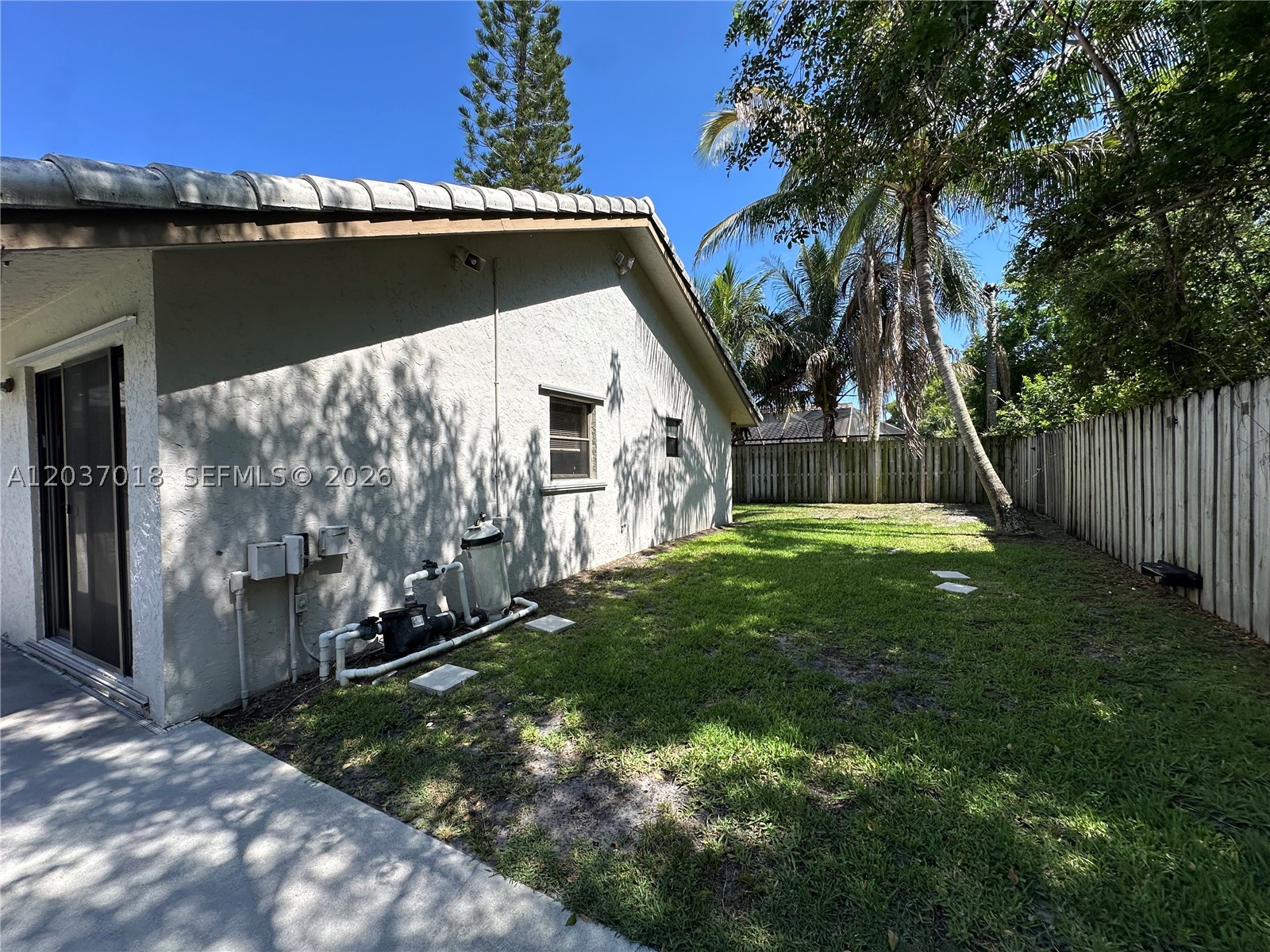 Sensational single-story pool home located in a highly desirable Boca Raton neighborhood! This charming 3-bedroom, 2-bathroom residence offers an open-concept layout highlighted by a lovely entryway and a beautiful mix of low-maintenance tile and luxury vinyl plank flooring. The heart of the home features a sleek kitchen fully equipped with quality countertops, and a seamless flow into the primary living spaces. Retreat to the spacious primary bedroom, conveniently located on the main level for ultimate privacy. Step outside into your private, fully fenced backyard oasis—complete with a sparkling swimming pool and a brunch-ready patio space perfect for outdoor lounging or entertaining. Unbeatable location just minutes from premium shopping, dining, parks, and major commuter routes. Move-in ready and a must-see!