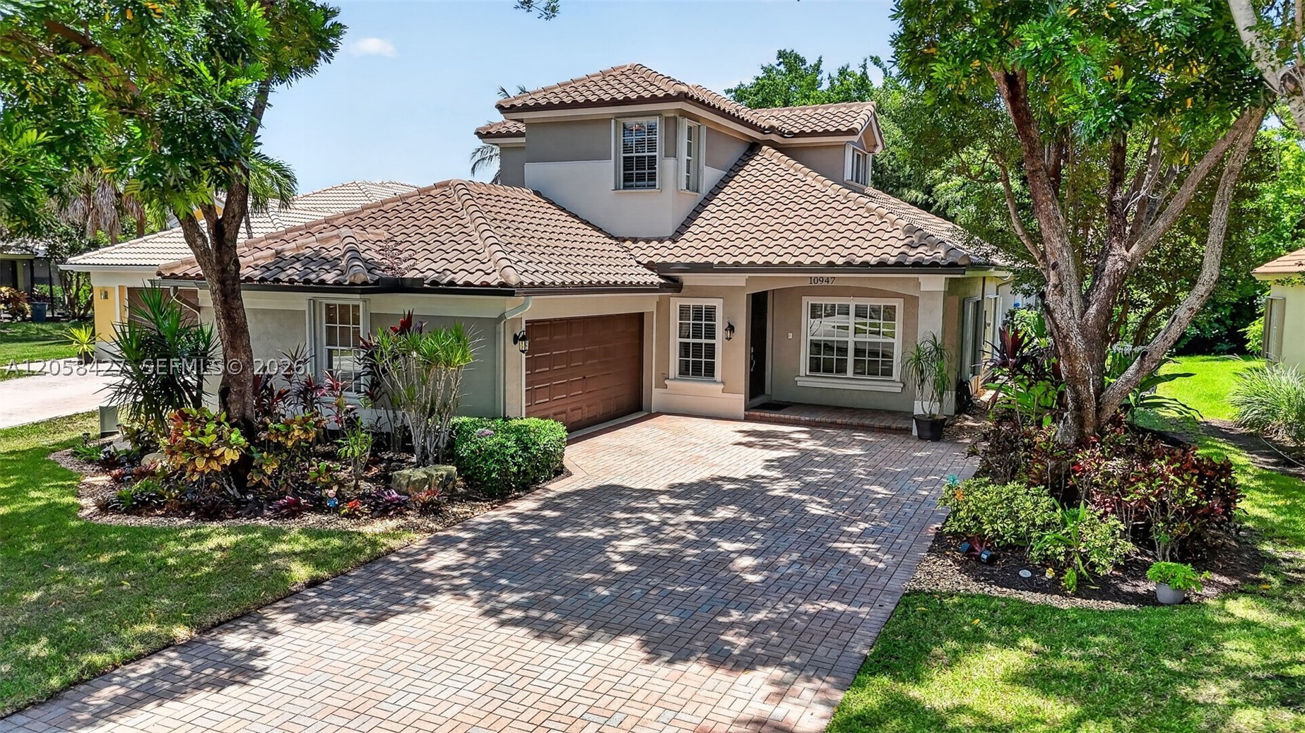 Welcome to this beautifully maintained Islamorada model in the highly sought-after community of Parkland Isles! This spacious home offers a highly desirable floor plan featuring 4 bedrooms plus a loft and 3 beautifully updated bathrooms.  The primary suite and a second bedroom with two full baths on the first floor and upstairs you’ll find two additional bedrooms, a loft, and a full bathroom, providing the perfect layout for family & guests.  The heart of the home is the stunning kitchen, complete with an oversized island, new stainless steel appliances, abundant cabinetry, and an open layout perfect for gatherings. The first-floor primary suite overlooks the pool and features dual walk-in closets, separate vanities, a soaking tub, walk-in shower, and private water closet. Step outside to your own backyard retreat featuring a screened-in pool, travertine deck, and exceptional privacy—creating the perfect resort-style setting for relaxing & entertaining. 2020 roof, partial impact windows w/ accordion shutters protecting the remaining openings, a paver driveway, and additional garage storage. Parkland Isles is a prestigious 24-hour guard-gated community offering tons of amenities including clubhouse, pool and spa, fitness center, tennis courts, basketball courts, playgrounds, & more. The low HOA includes Comcast high-speed internet, cable & ADT alarm monitoring. HOA approval is not required for buyers. A-rated schools, shopping, dining, parks, & houses of worship all near by.