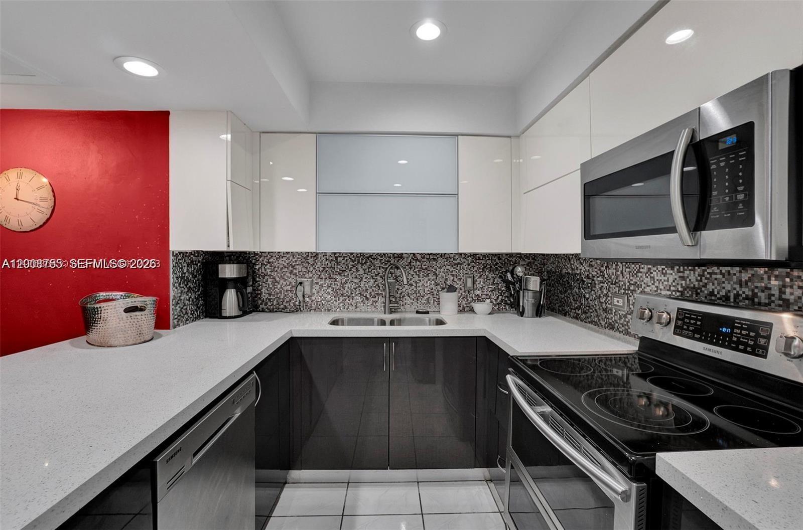 Spectacular water and Golf Course view in a tree story Townhouse Located at the Country Club of Miami 3 full bathroom / 3 bedroom, SS appliances, Washer and Dryer, balcony, patio, plenty of storage. Gated Community. Two Tandem Parking space and guess Parking. New roof.