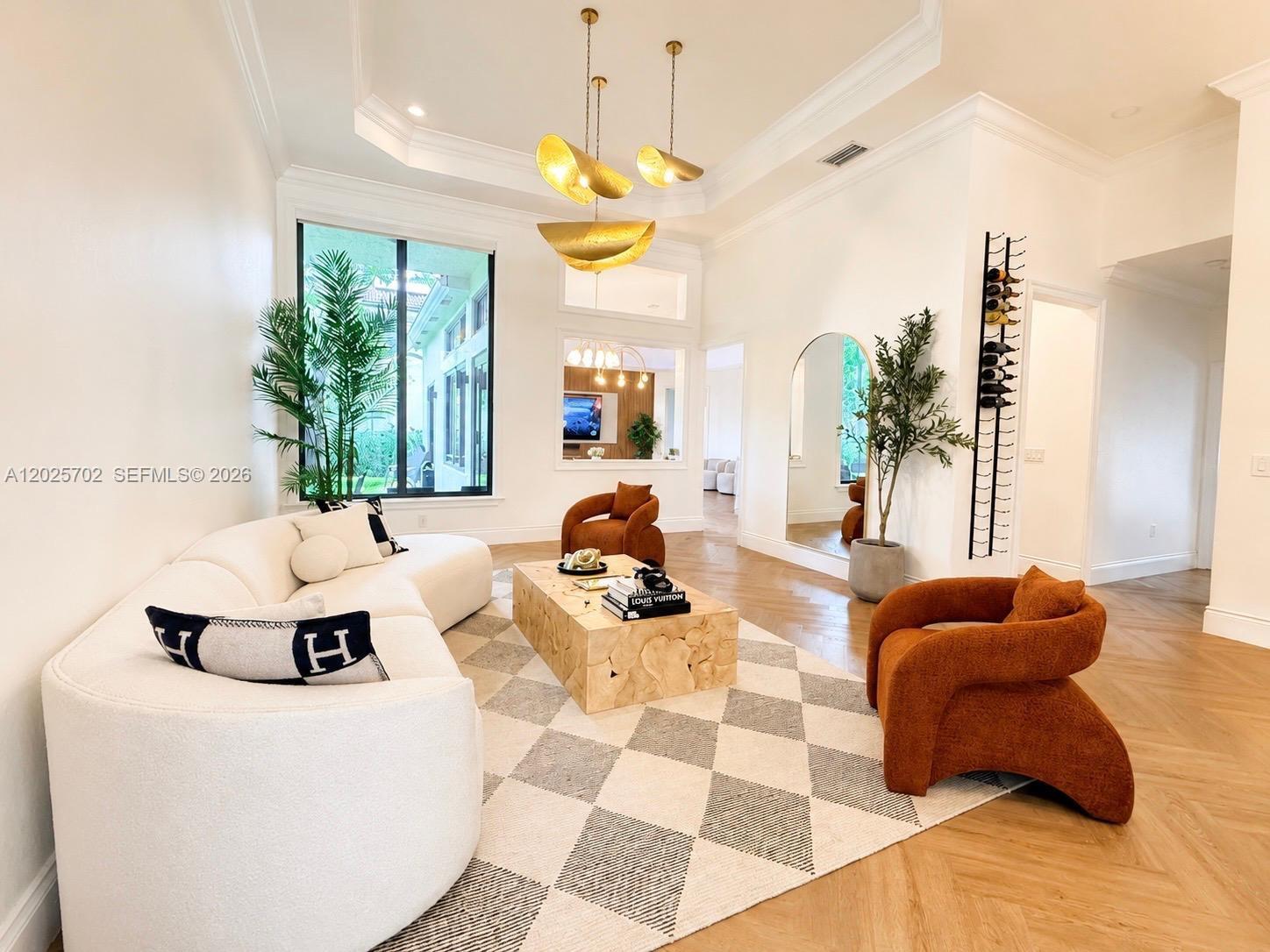 Immaculate fully renovated one-story home located on an oversized corner lot within a quiet cul-de-sac in the prestigious Isles of Sunset Lakes. This elegant residence features soaring ceilings, new herringbone flooring, crown molding, smart recessed lighting, motorized blinds, impact windows, wired cameras, and WiFi access points throughout.

The designer chef’s kitchen showcases marble countertops with waterfall edge and matching backsplash, double-stacked cabinetries', custom range hood, pot filler, under-counter ice maker, two pantries, and brand-new WiFi-enabled Samsung appliances.

The spacious primary suite includes newly designed his-and-hers custom closets, plus an additional custom closet system in a secondary bedroom. Additional upgrades include new PEX plumbing (2022), newer A/C units and water heater, remodeled guest bathroom, redesigned front landscaping, and newly planted Clusia hedges for added backyard privacy.

Home has an expansive living space of 2,844 SF, with 5 beds & 3 baths, in a oversized lot with plenty of room for a custom pool and dream outdoor oasis.
3-parking garage with additional space in driveway for four additional cars.

Club house for family entertainment with pool, gym, tennis and basketball court, kid's park & more. Beautiful gated community with lakes. Don't miss the opportunity to make it yours NOW!