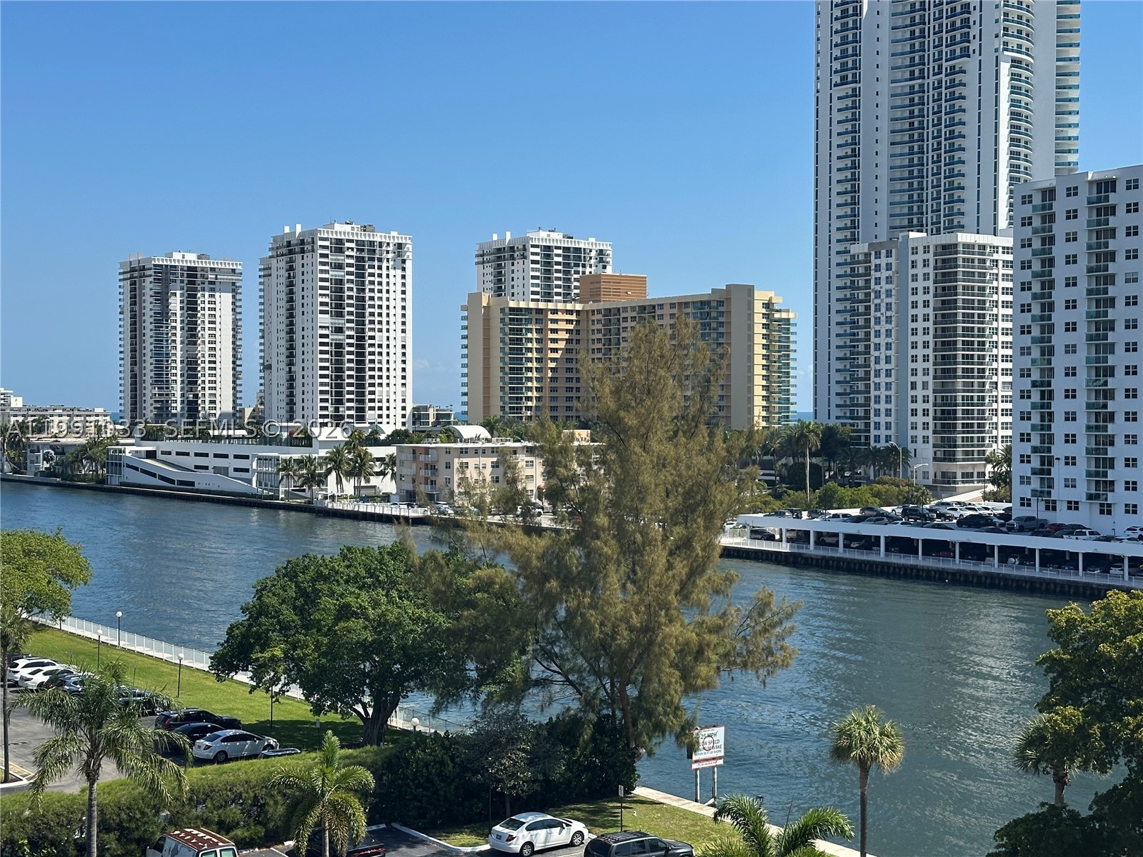 Experience the best of South Florida living in this stunning 1-bedroom, 1.5-bath condo located in the highly sought-after Three Islands community. This beautifully maintained unit is filled with natural light and offers a bright, inviting atmosphere that truly feels like home. Ideally situated in the heart of Hallandale Beach, you’ll enjoy the convenience of being just a short walk to the beach and minutes from top shopping centers, restaurants, and cozy cafés. The building features a full suite of newly renovated, resort-style amenities, including, 24-hour security for peace of mind. Elegant clubhouse for social events and gatherings. Heated swimming pool. State-of-the-art fitness center. Tennis courts for outdoor recreation. Shuttle service to local shopping and Aventura Mall. Wi-Fi in all common areas. This is a perfect opportunity to enjoy a luxurious lifestyle in a prime location!