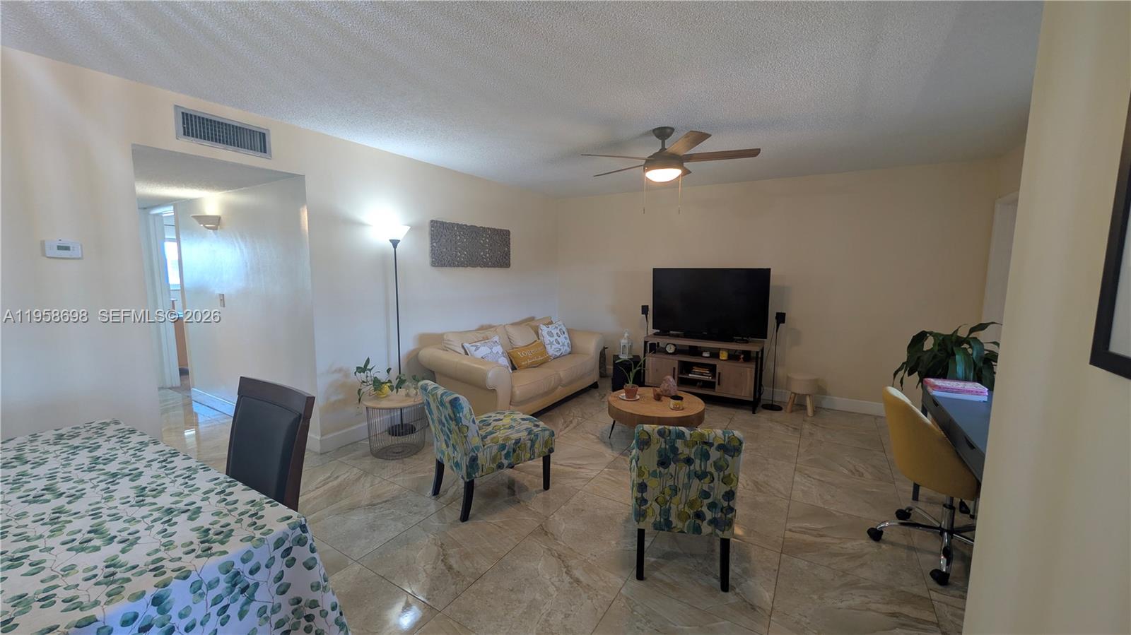 Discover this sun-filled residence in the 55+ gated Beverly Hills community, ideally located in the heart of Hollywood. Enjoy quick access to I-95, the Turnpike, beaches, the Hard Rock Casino & Resort, and everyday essentials all just minutes away, with parks, dining, and shopping within walking distance.

The home offers 2 generously sized bedrooms and 2 full bathrooms, filled with natural light. Neutral tile flooring keeps the space bright and inviting, while the front patio overlooks peaceful green space, perfect for relaxing or enjoying your morning coffee.

Residents enjoy a vibrant lifestyle with resort style amenities, including a pool, fitness center, library, and a full calendar of social activities such as game nights, karaoke, Latin Night, and holiday celebrations. Assigned parking and a private storage unit are included.

Easy to show and financing available. No pets permitted. HOA requires 20% down, a minimum 700 credit score, and three years of tax returns. Rentals allowed once per year.