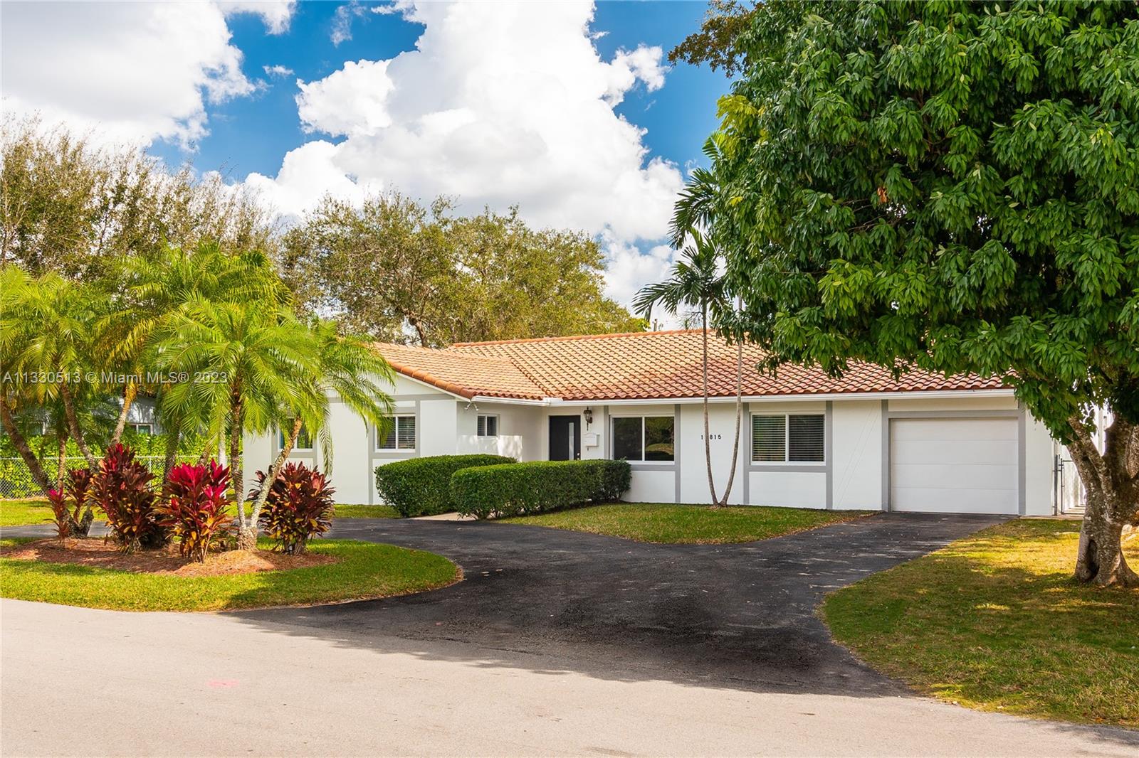 Enjoy this updated 4 bed/3 baths Palmetto Bay home with 2,936 adj. sq. ft. This contemporary home boasts a spacious living and dining area that opens to an updated kitchen with a breakfast bar/family room. Large bedrooms and remodeled bathrooms with new flooring and impact windows & doors make this home ready to move in! Not to mention the laundry room which is huge and has a 1 car garage. Entertaining space around the pool area includes a screened-covered patio and an oversized landscaped fenced yard with a sparkling pool! Great public schools are a big plus.