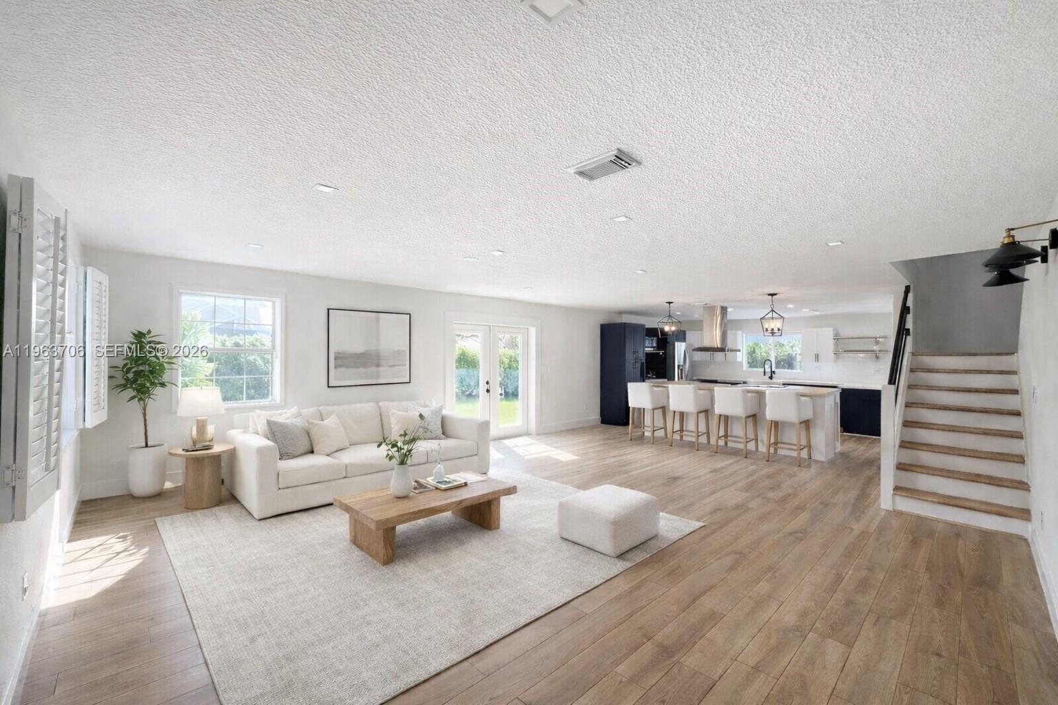 Beautiful corner-lot home in Lakes by the Bay! This modern 4-bedroom, 2.5-bath home with a 2-car garage offers a stylish kitchen with quartz countertops, LG appliances, and a gas range. The open floor plan creates spacious living, dining, and family areas—perfect for entertaining. The oversized primary suite includes dual walk-in closets, a large bathroom, and a versatile den. With ample storage and partial impact windows/doors, this home is both functional and stylish. Step outside to a covered terrace and expansive backyard ready for gatherings or your dream oasis.