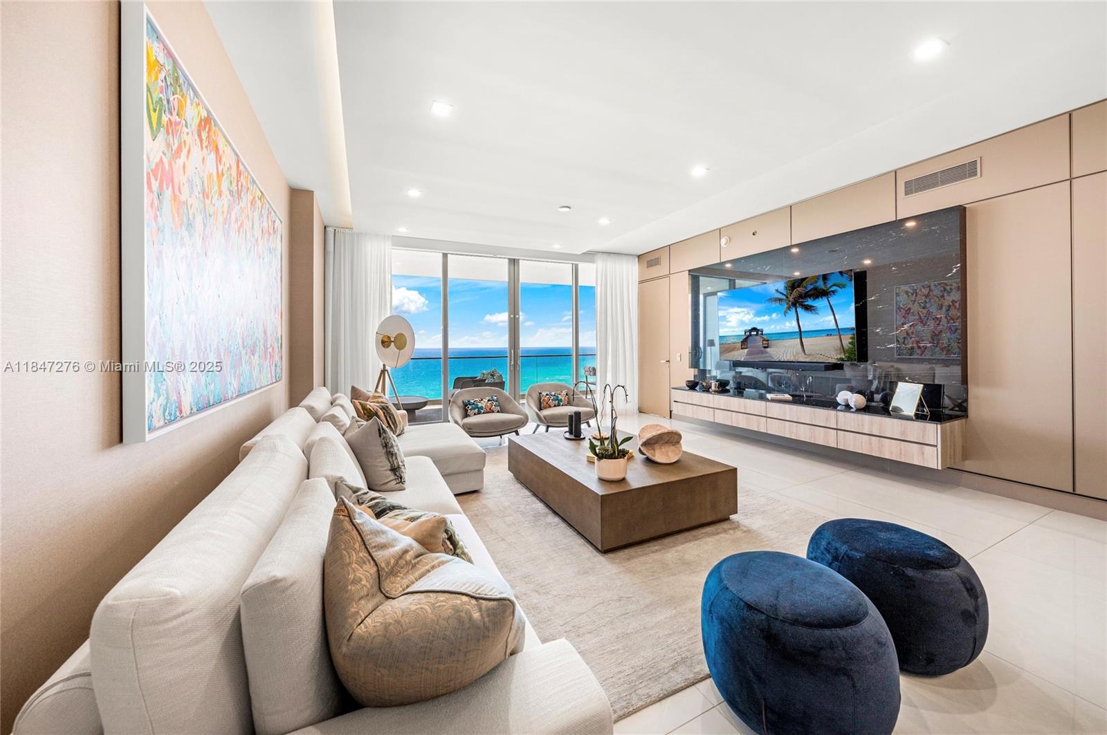 Brand new, fully upgraded residence. Flow-thru unit with 2 extensive terraces, one facing the ocean / white sand, the 2nd is facing the canal, city skyline / sunset. Designed by prestigious Design firm in an elegant, modern, flawless style. Wooden panels throughout, TV console in stone, larger floor tiles, personalized furniture for master bed, living room and guest suites. Top of the line appliances, Armani Casa kitchen & bathroom fixtures. Italian furniture. Costumized closets with lightning. Dropped ceiling. Ready to be occupied this impressive turn-key fully decorated oceanfront condo. Price includes everything except 2 art pieces (as value is considerably high), can be negotiated. Foyer also is upgraded/finished.
3 full beds, Studio can be turned into a 4th bedroom with a Jack/Jill.